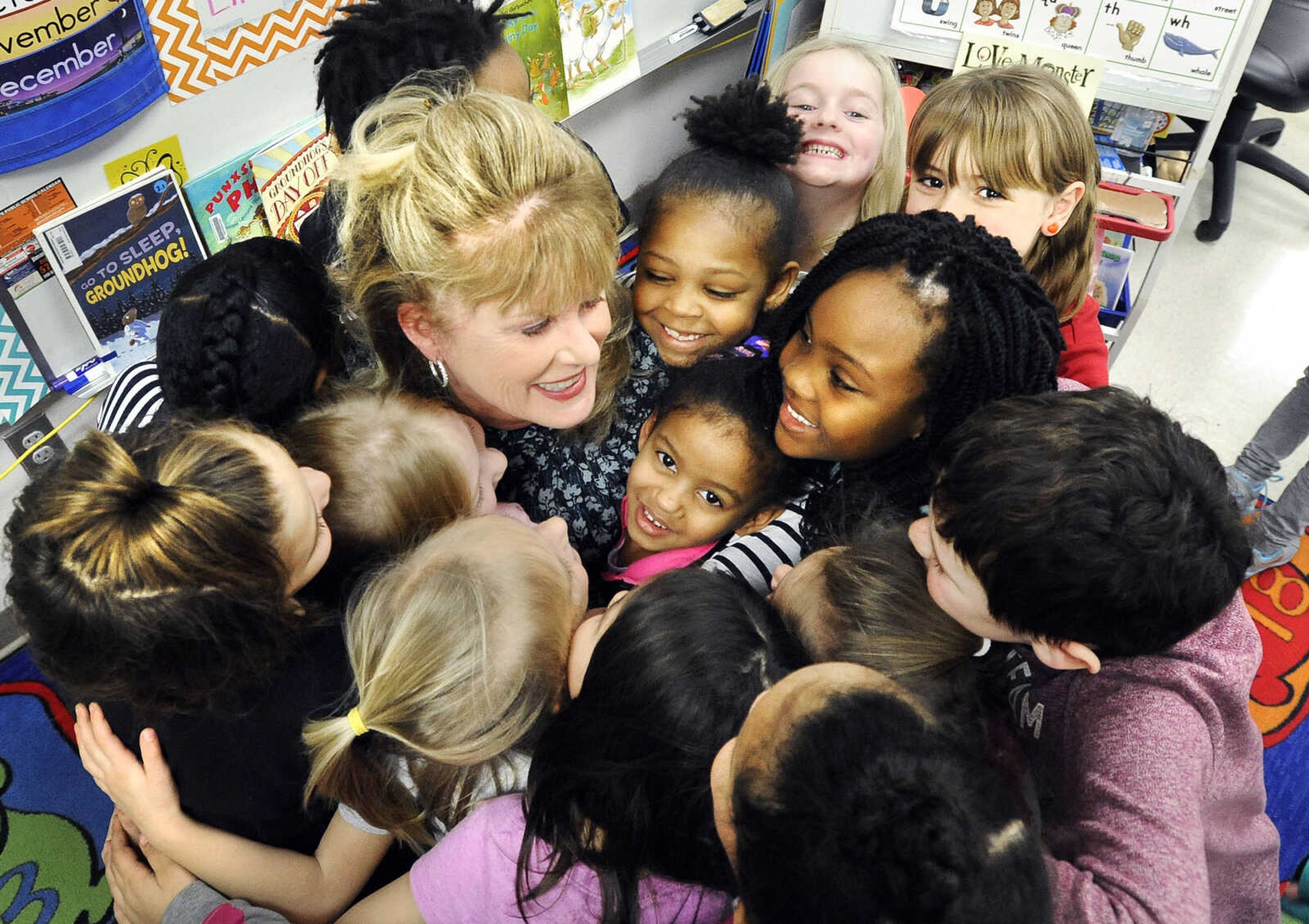 LAURA SIMON ~ lsimon@semissourian.com

Kindergarten students surround Blanchard Elementary principal, Barbara Kohlfeld, for a group hug, Monday, Feb. 8, 2016. The Cape Girardeau school was named a National Blue Ribbon School by the U.S. Department of Education.