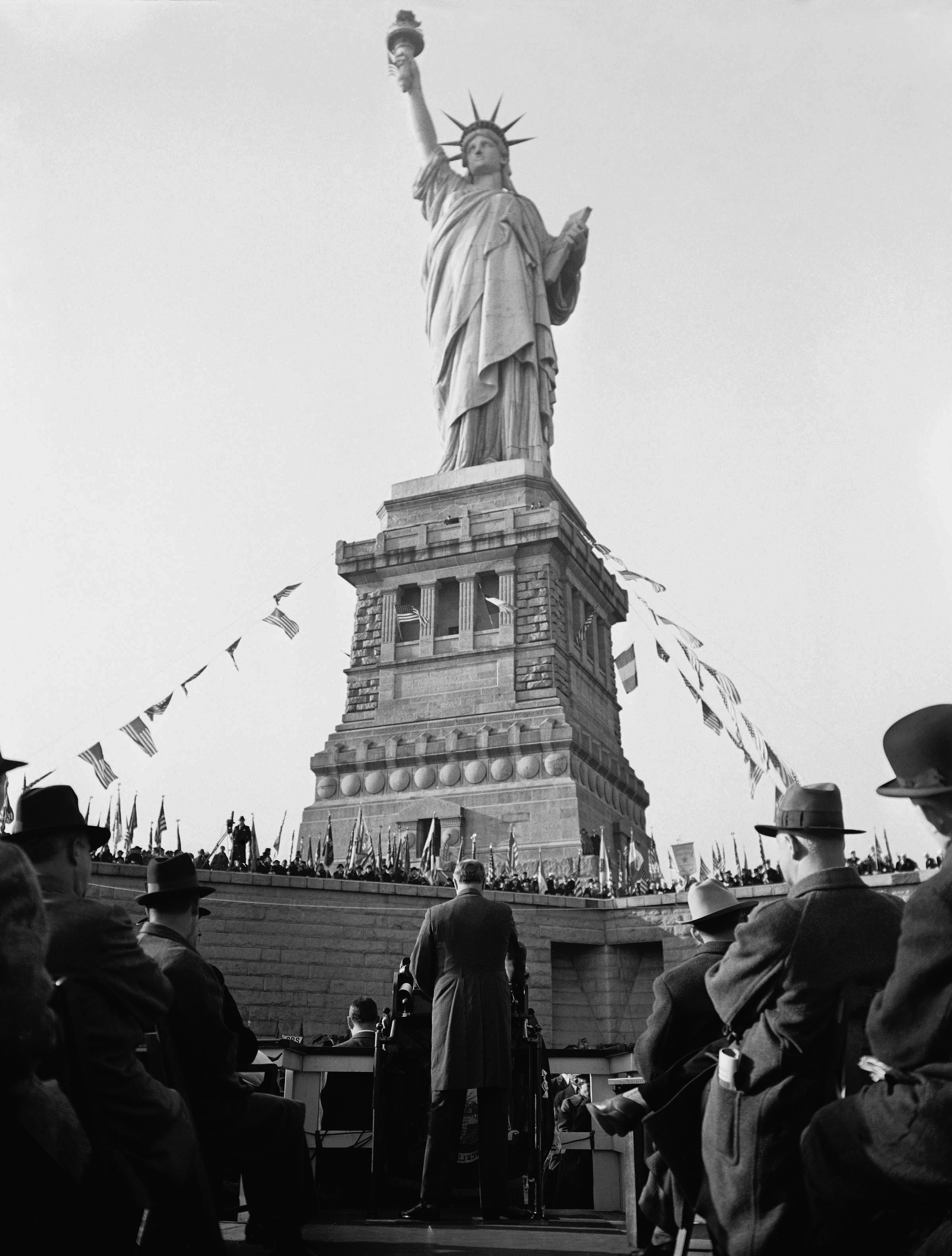 President Franklin Roosevelt speaks at  the 50th anniversary of the erection of the State of Liberty in New York, on Oct. 28, 1936. He declared that, "To the message of Liberty which America sends to all the world must be added her message of peace." The statue was a gift from the people of France and was dedicated Oct. 28, 1886.