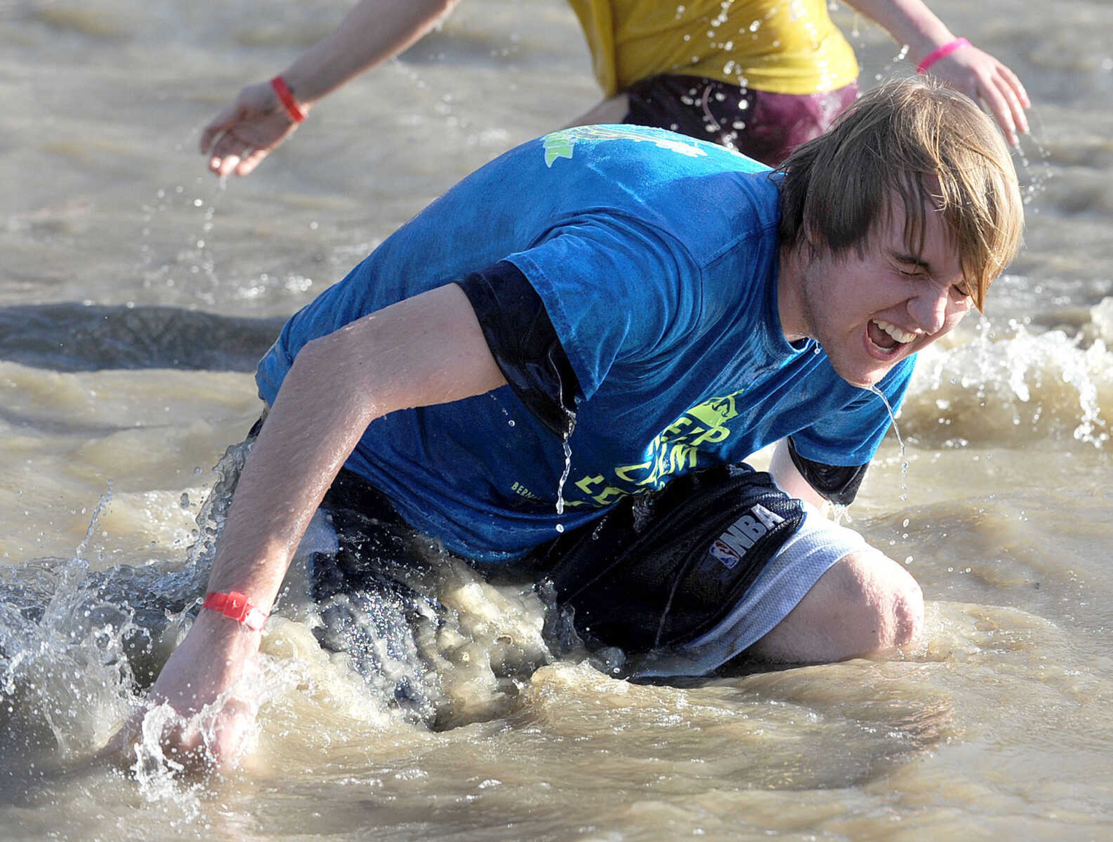 LAURA SIMON ~ lsimon@semissourian.com
People plunge into the cold waters of Lake Boutin Saturday afternoon, Feb. 2, 2013 during the Polar Plunge at Trail of Tears State Park. Thirty-six teams totaling 291 people took the annual plunge that benefits Special Olympics Missouri.