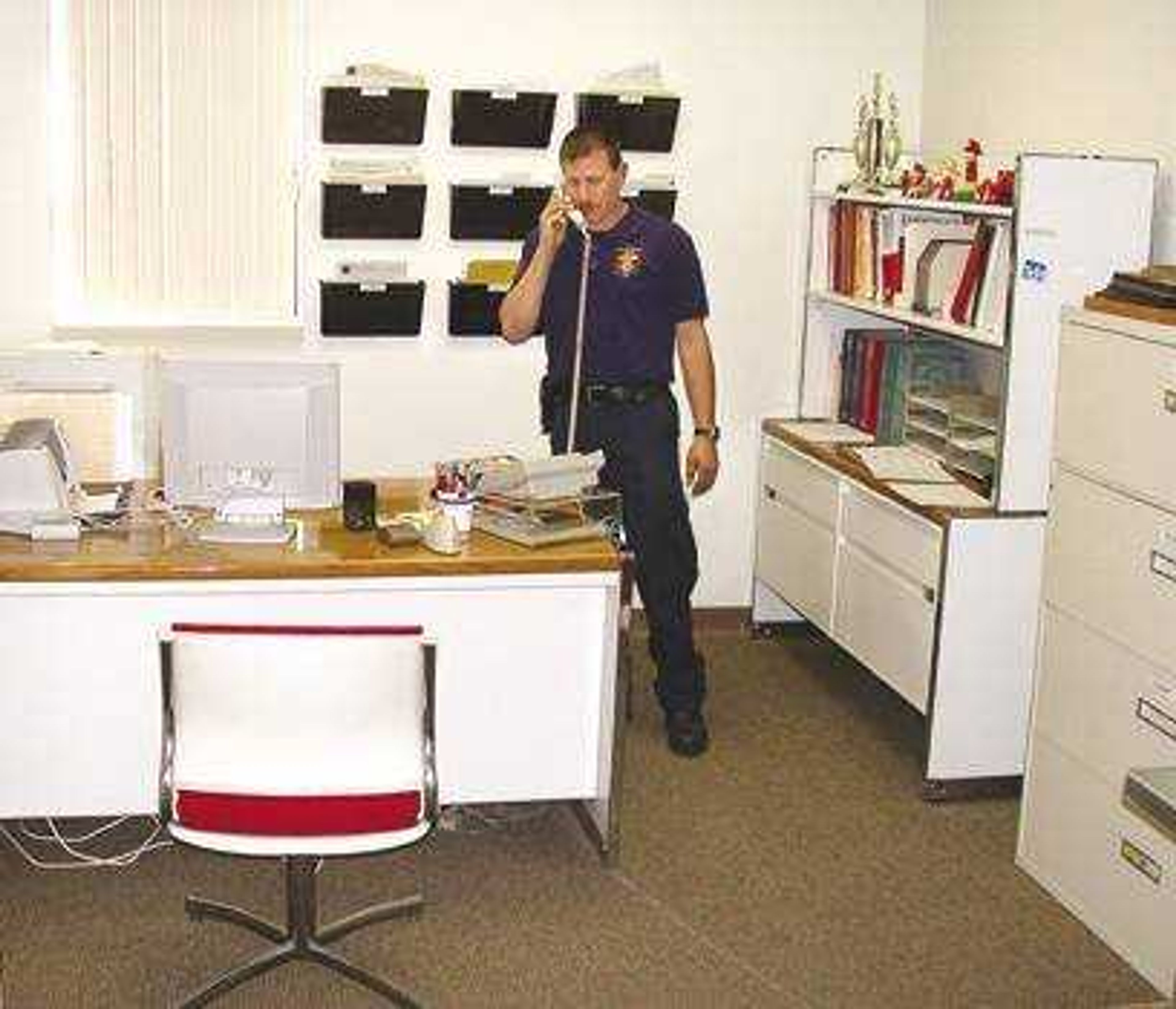 Jackson firefighter Robbie Greif answered a call inside an office at the city's rebuilt fire and police complex.