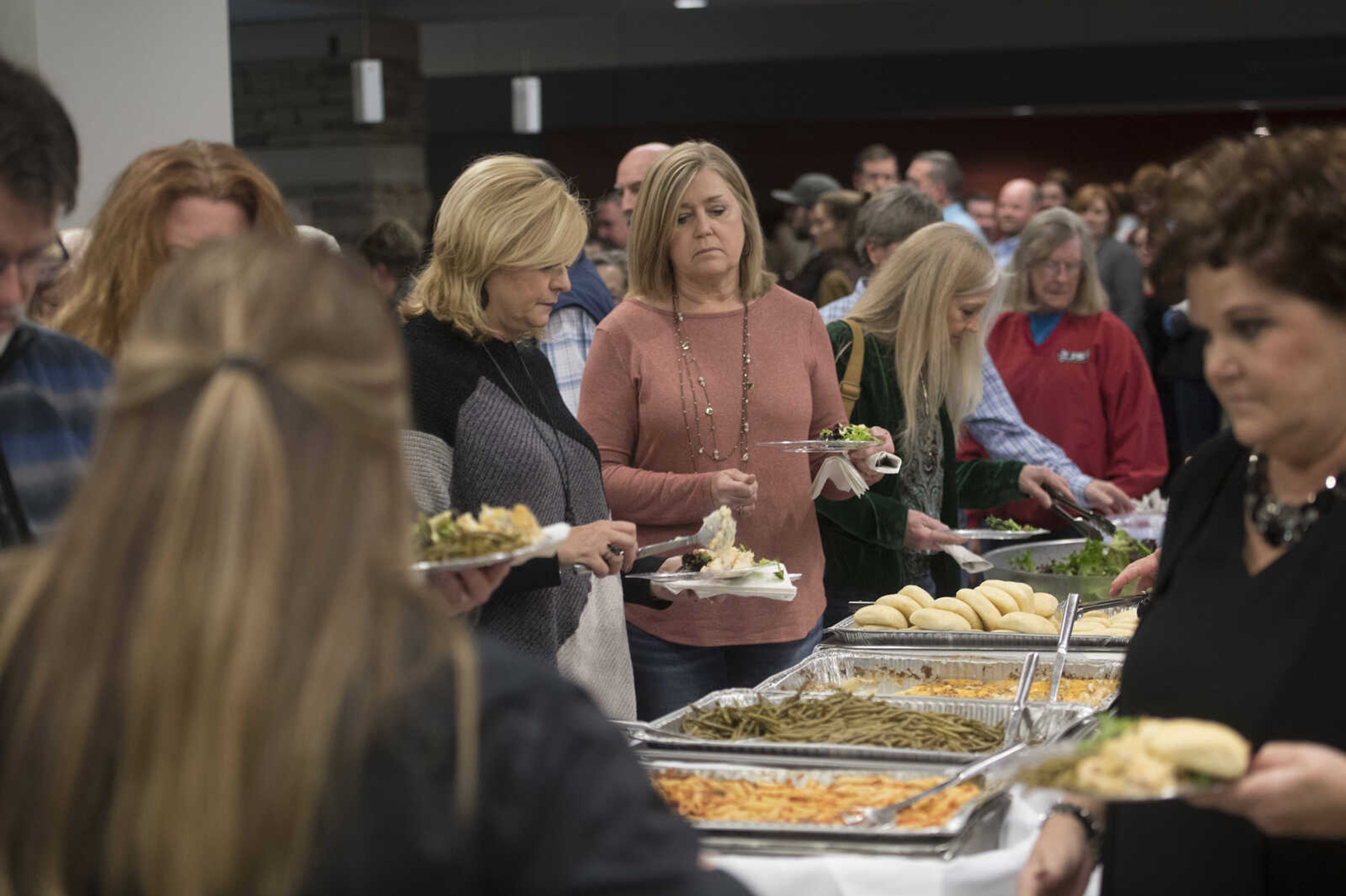 Attendees get food during the Humane Society of Southeast Missouri Power of Pawsitivity fundraiser Saturday, Feb. 29, 2020, at the Jackson Civic Center in Jackson.