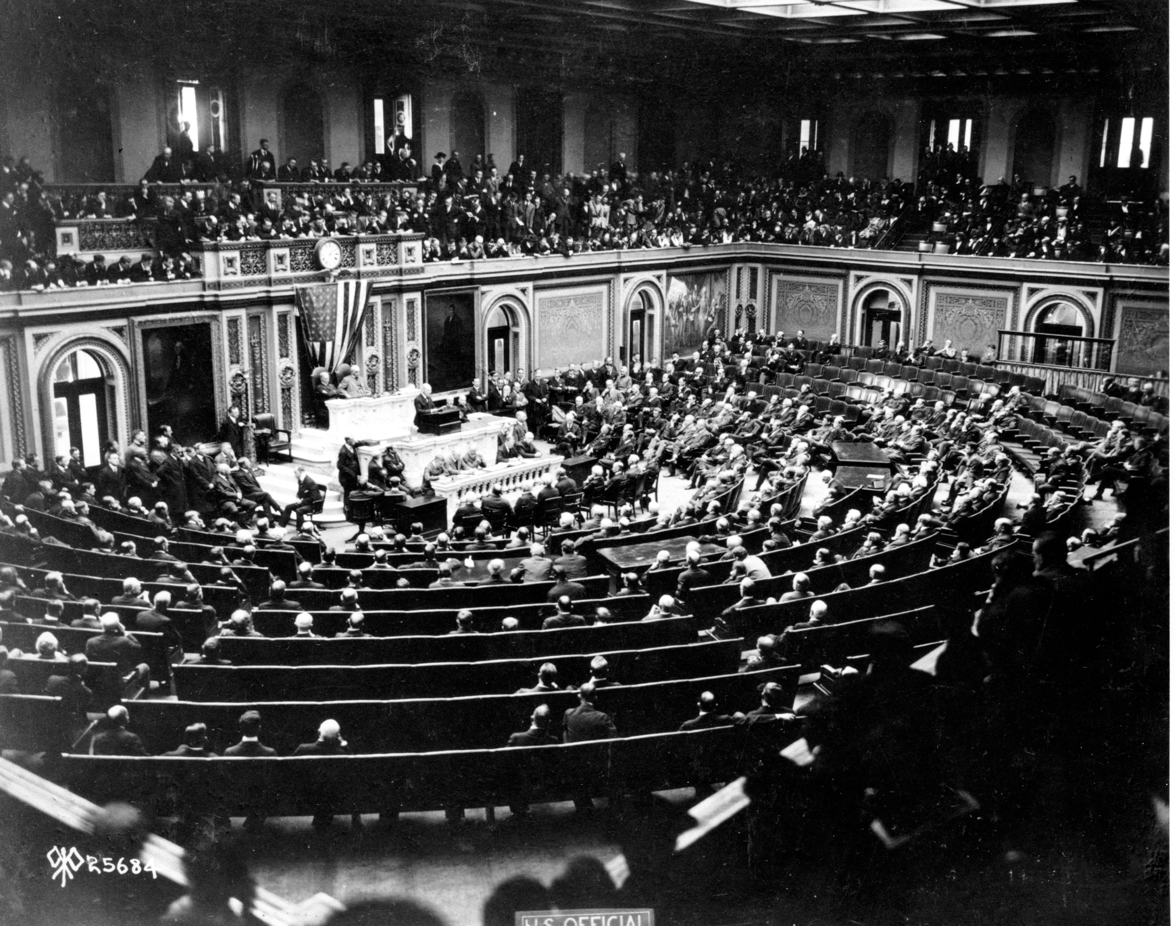 U.S. President Woodrow Wilson reads the terms of the German Armistice to Congress in joint session and announces the end of World War I in Washington, D.C., on Nov. 11, 1918. The peace plans proposals are outlined in the 'fourteen points.' 