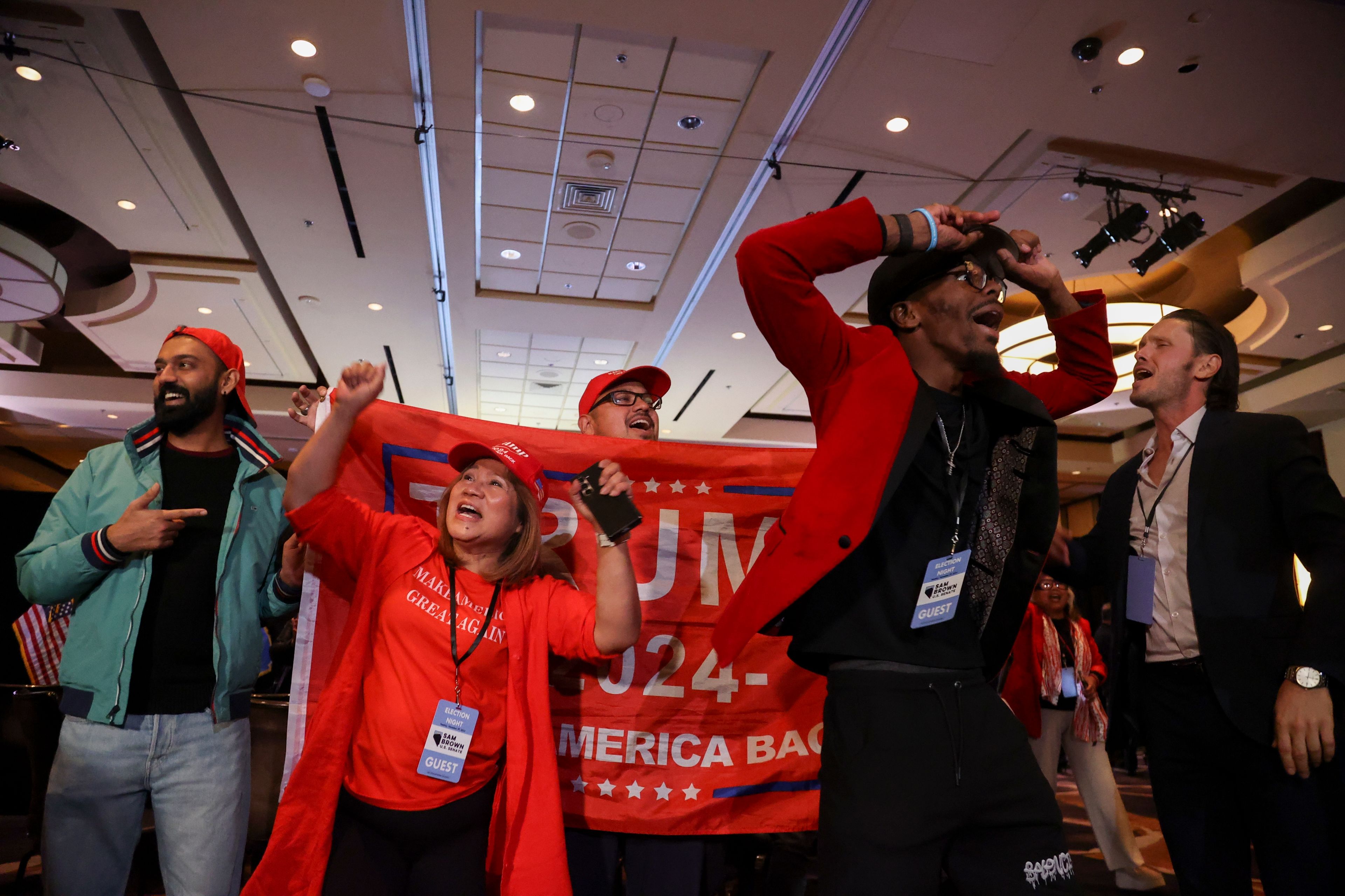 Supporters of Republican presidential nominee former President Donald Trump cheer as Pennsylvania votes are counted, during an election night watch party Tuesday, Nov. 5, 2024, in Las Vegas, Nev. (AP Photo/Ian Maule)