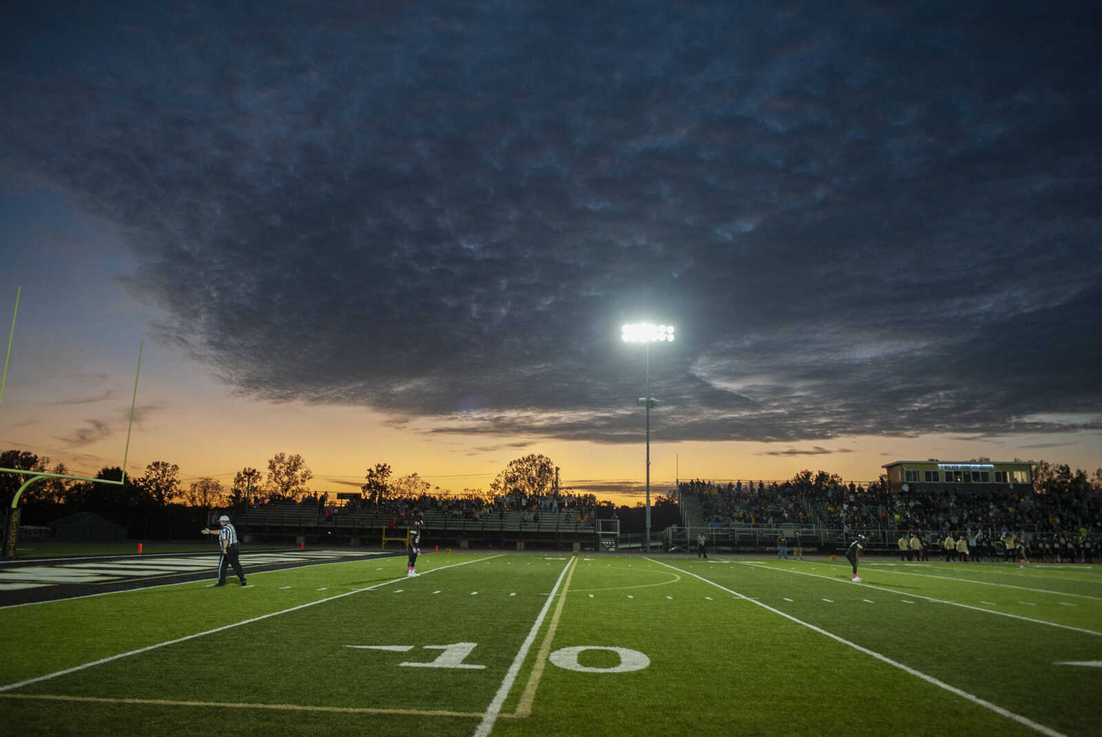 The sky changes as the sun goes down at the Jackson Indians' 35-14 victory over Farmington on Friday, Oct. 4, 2019, in Farmington, Missouri.