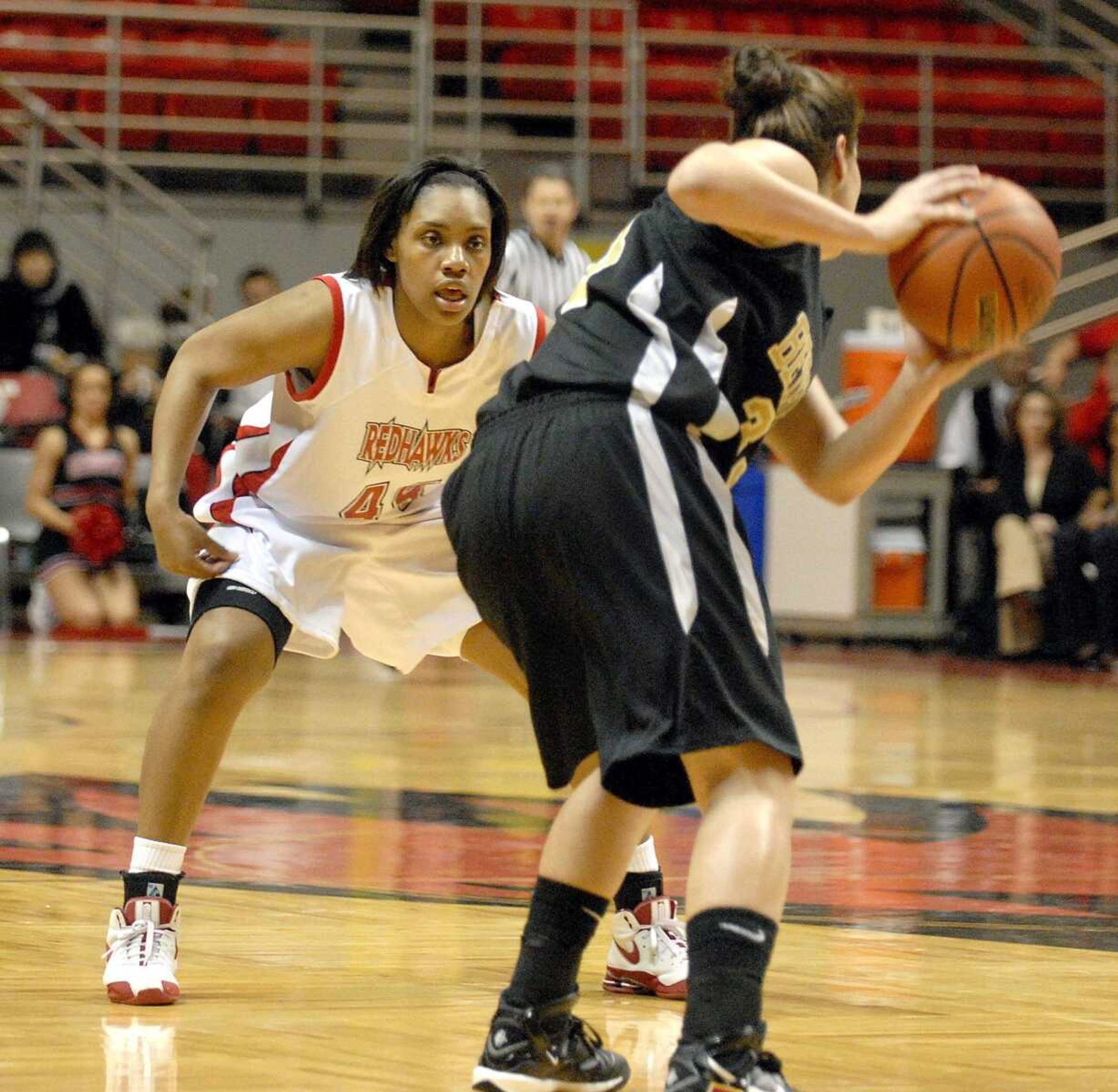 ELIZABETH DODD ~ edodd@semissourian.com
Southeast Missouri State's Lesley Adams, left, keeps her eye on the ball playing defense against Bethel's Nina Djokovic in first half at the Show Me Center Wednesday.