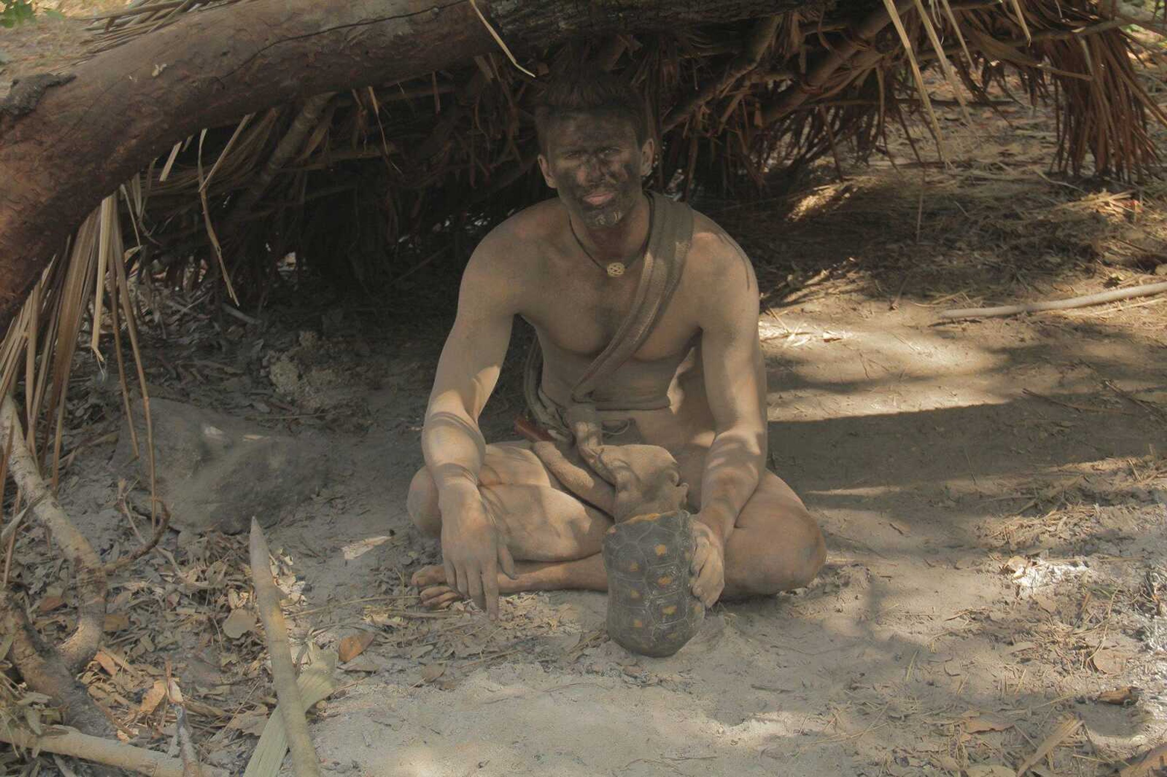 Zack Buck sits in a man-made shelter in Guyana during filming of the Discovery Channel's "Naked and Afraid." (Photo submitted)