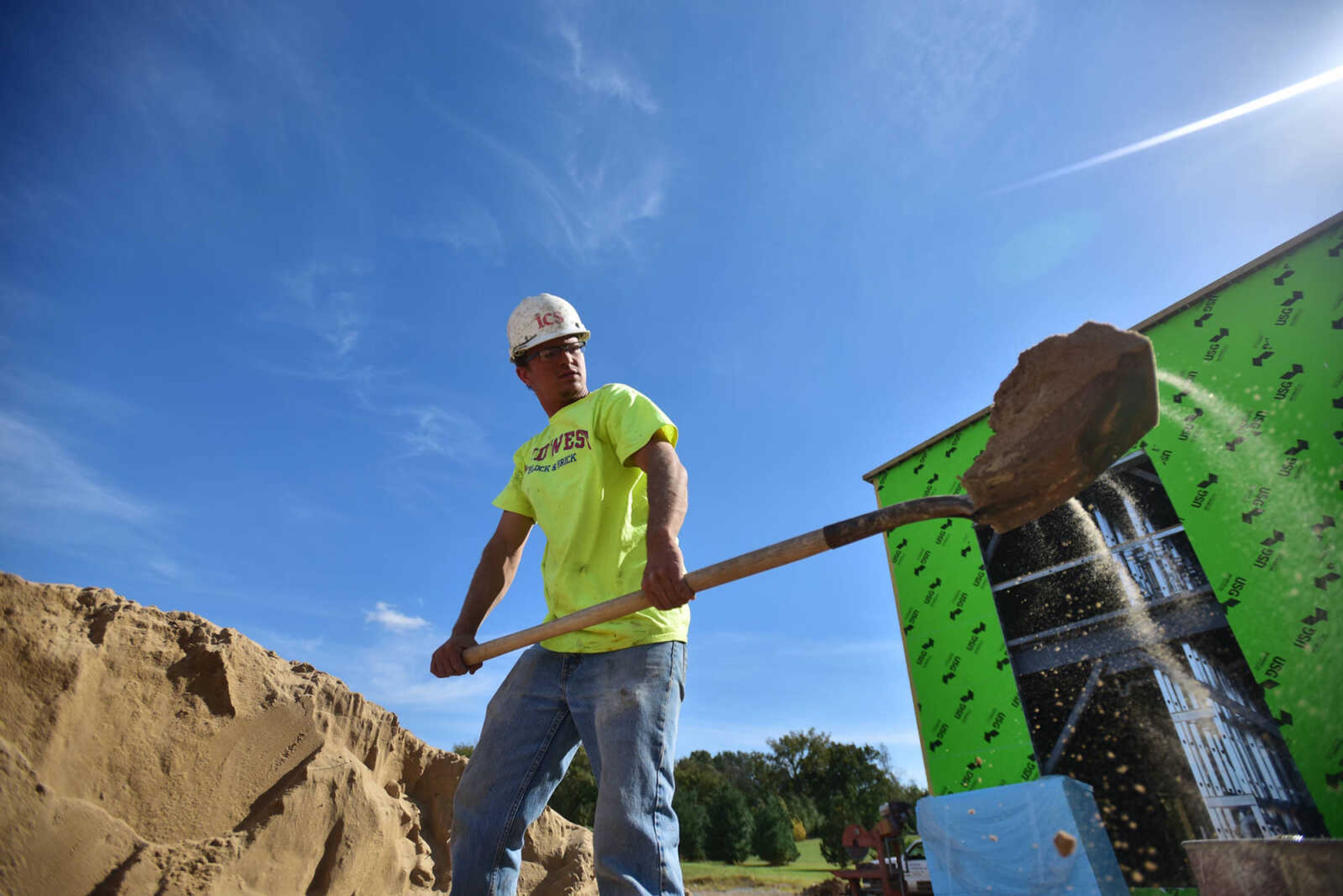 ANDREW J. WHITAKER ~ awhitaker@semissourian.com
Austin Arnold with Arnold Masonry uses a shovel to transfer soil while working on the Career Technology Center extension building Monday, Oct. 17, 2016 in Cape Girardeau.