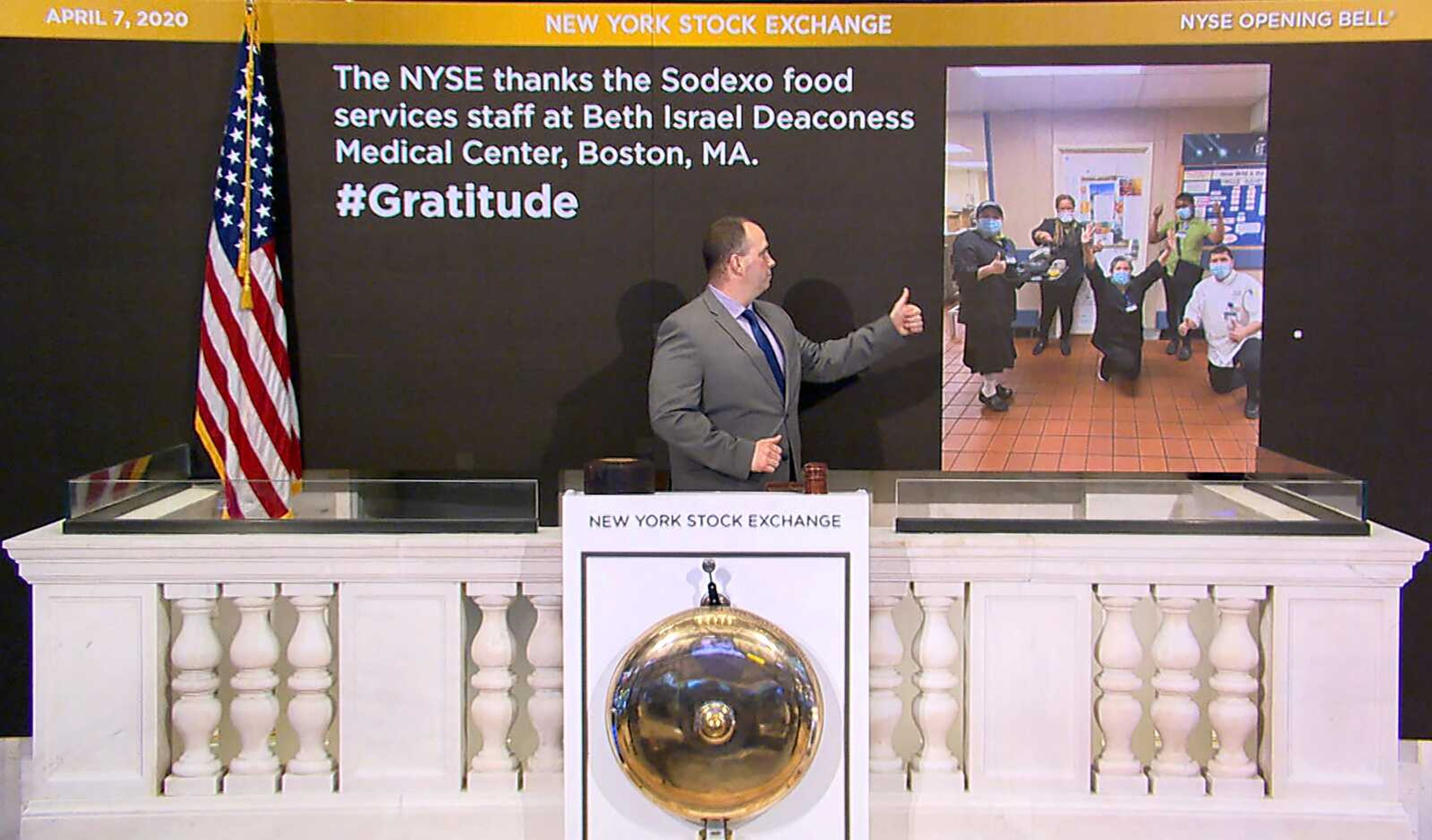 Tommy Gannon, assistant supervisor of facilities at New York Stock Exchange, rings the opening bell Tuesday and recognizes the Sodexo food services staff at Beth Israel Deaconess Medical Center in Boston.