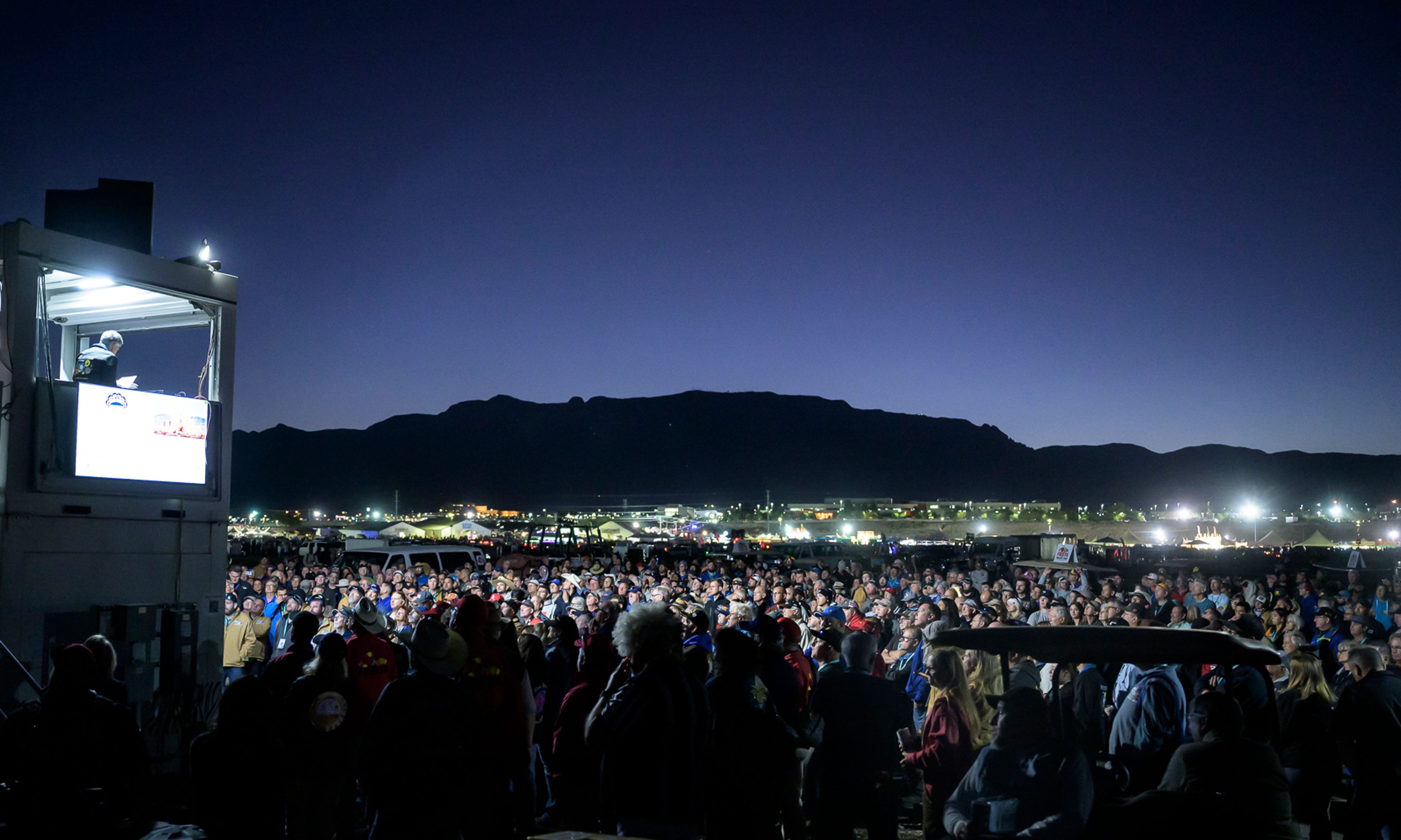 Pilots gather for a briefing just before sunrise prior to the start of the 52nd Albuquerque International Balloon Fiesta in Albuquerque, N.M., on Saturday, Oct. 5, 2024. (AP Photo/Roberto E. Rosales)