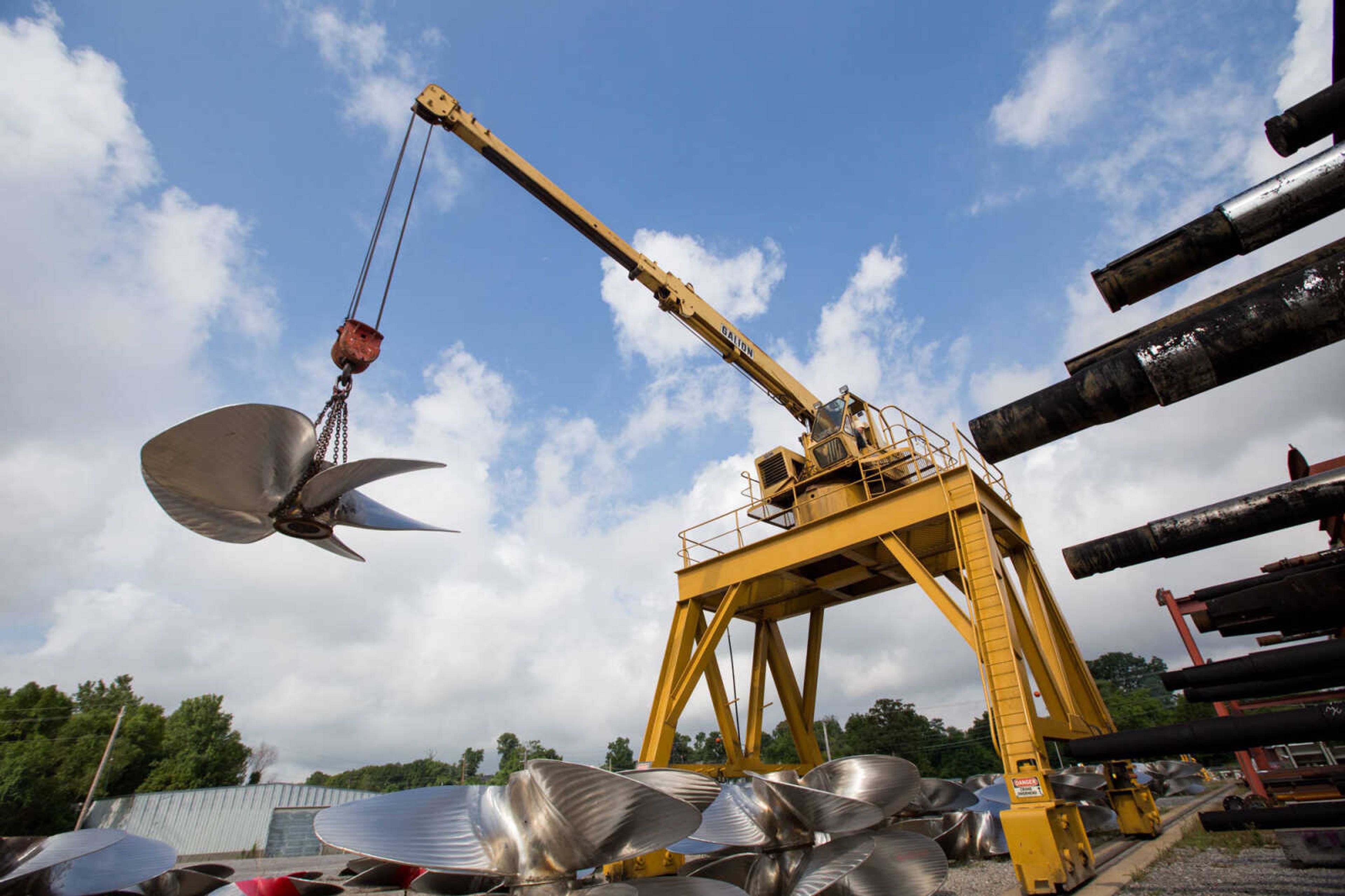 GLENN LANDBERG ~ glandberg@semissourian.com

Logan Farrenburg operates a crane to move propellers outside the repair shop at Missouri Dry Dock and Repair Co. in Cape Girardeau Wednesday, July 28, 2016.