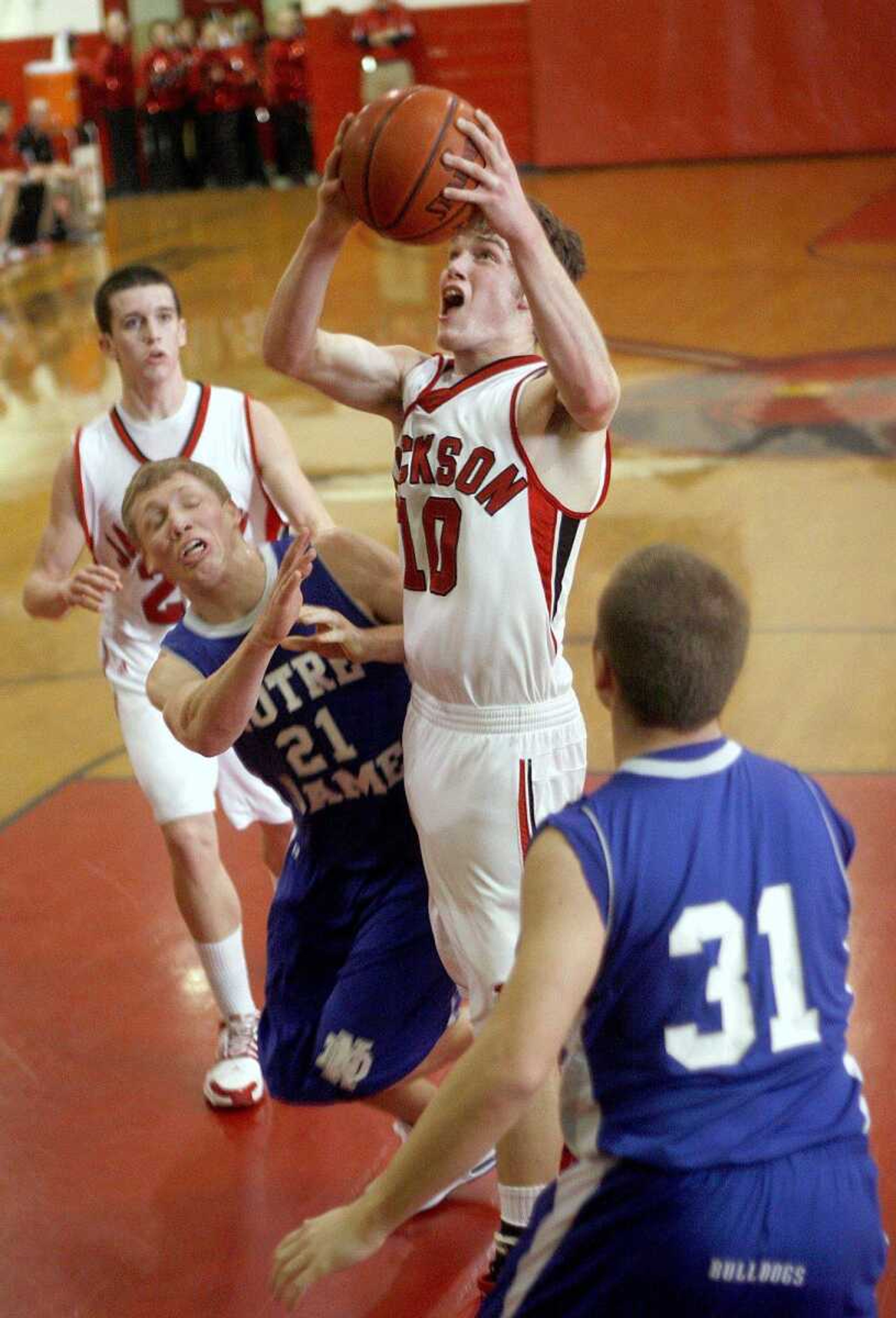 ELIZABETH DODD ~ edodd@semissourian.com
Jackson's Marcus Harris attempts two points against Notre Dame's Alex Bader in the first half Friday night at Jackson.