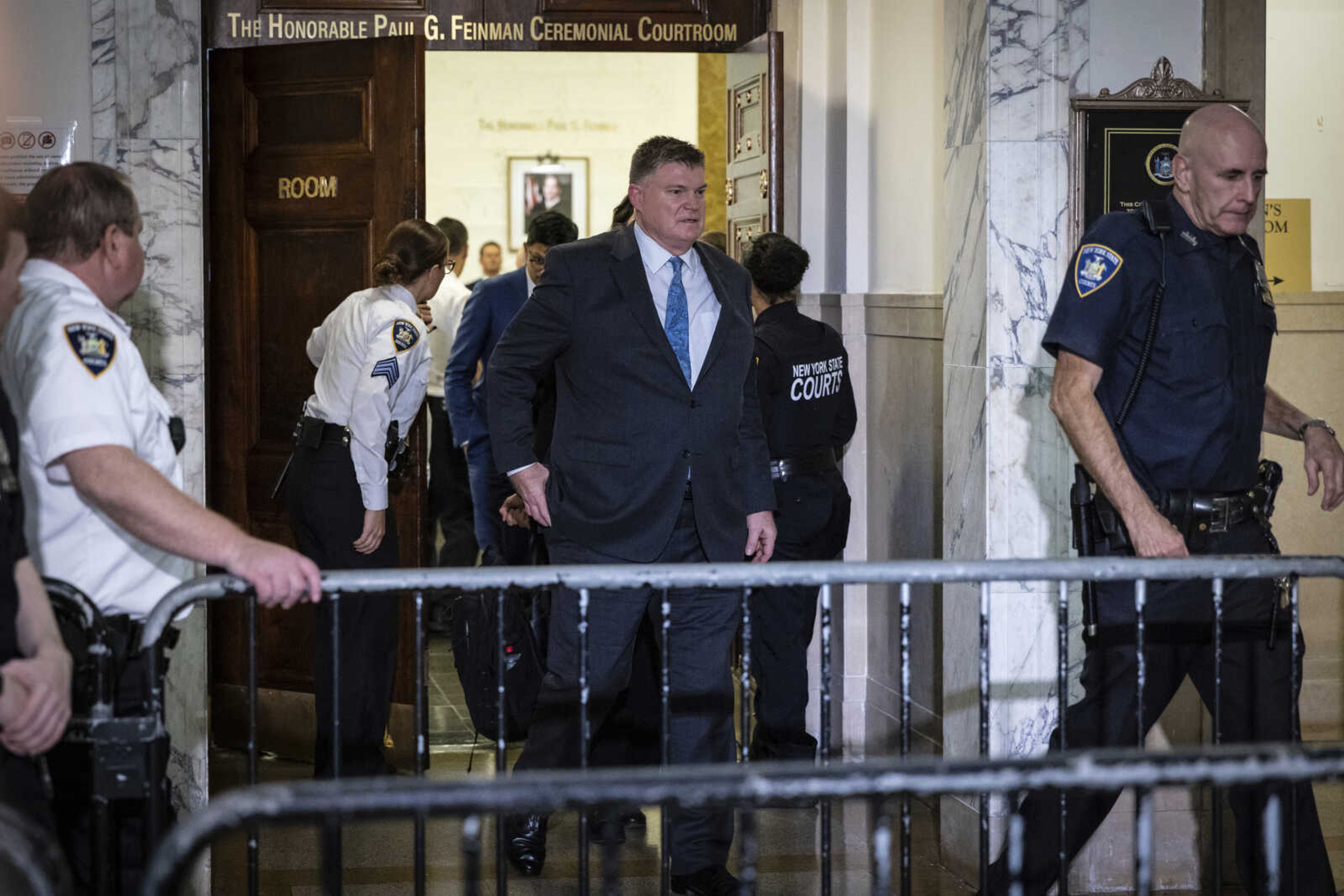 Real Estate Brokerage executive, Doug Larson leaving the courtroom after after giving witness testimony in civil business fraud trial of former President Donald Trump at New York Supreme Court, Tuesday, Oct. 17, 2023, in New York. (AP Photo/Stefan Jeremiah)