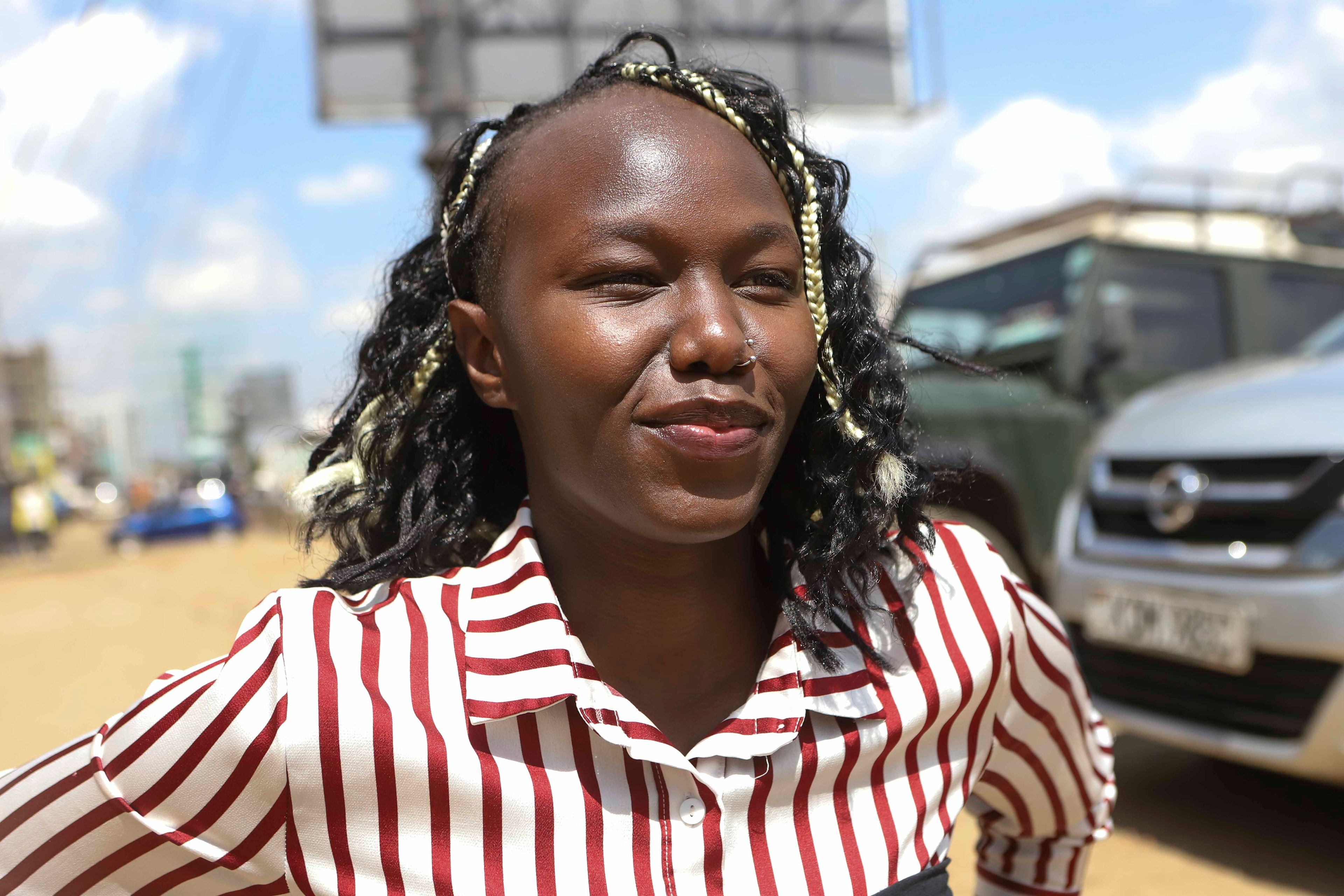 Carol Mwikali, who uses a wheelchair, poses for a photo during an interview with Associated Press in Nairobi, Kenya, Wednesday, Oct. 9, 2024. (AP Photo/Brian Inganga)