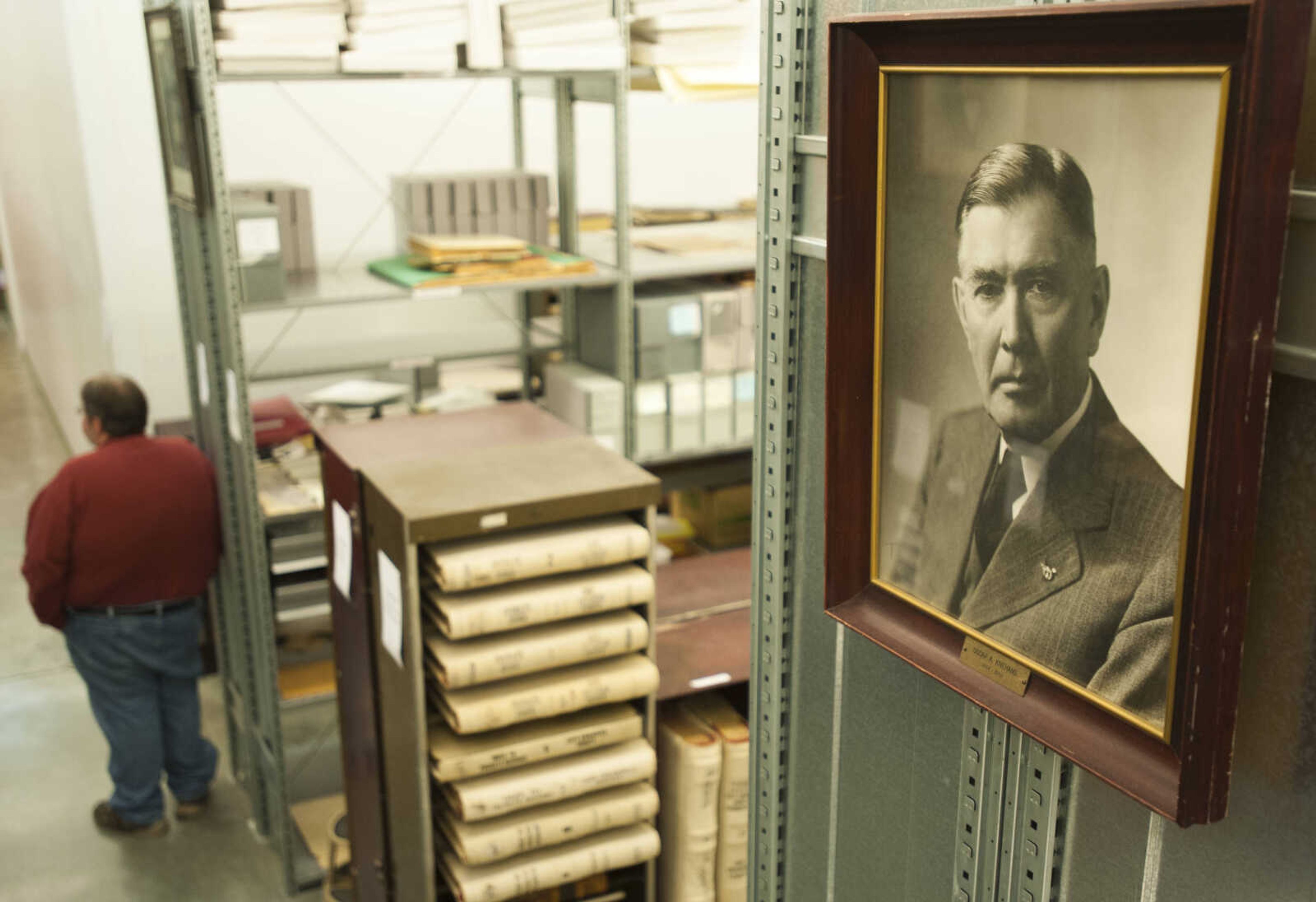 A portrait of former Common Pleas Court judge Oscar Knehans hangs on a shelf of archived court records Thursday, March 8, 2018, at the Cape Girardeau County Archive Center in Jackson.