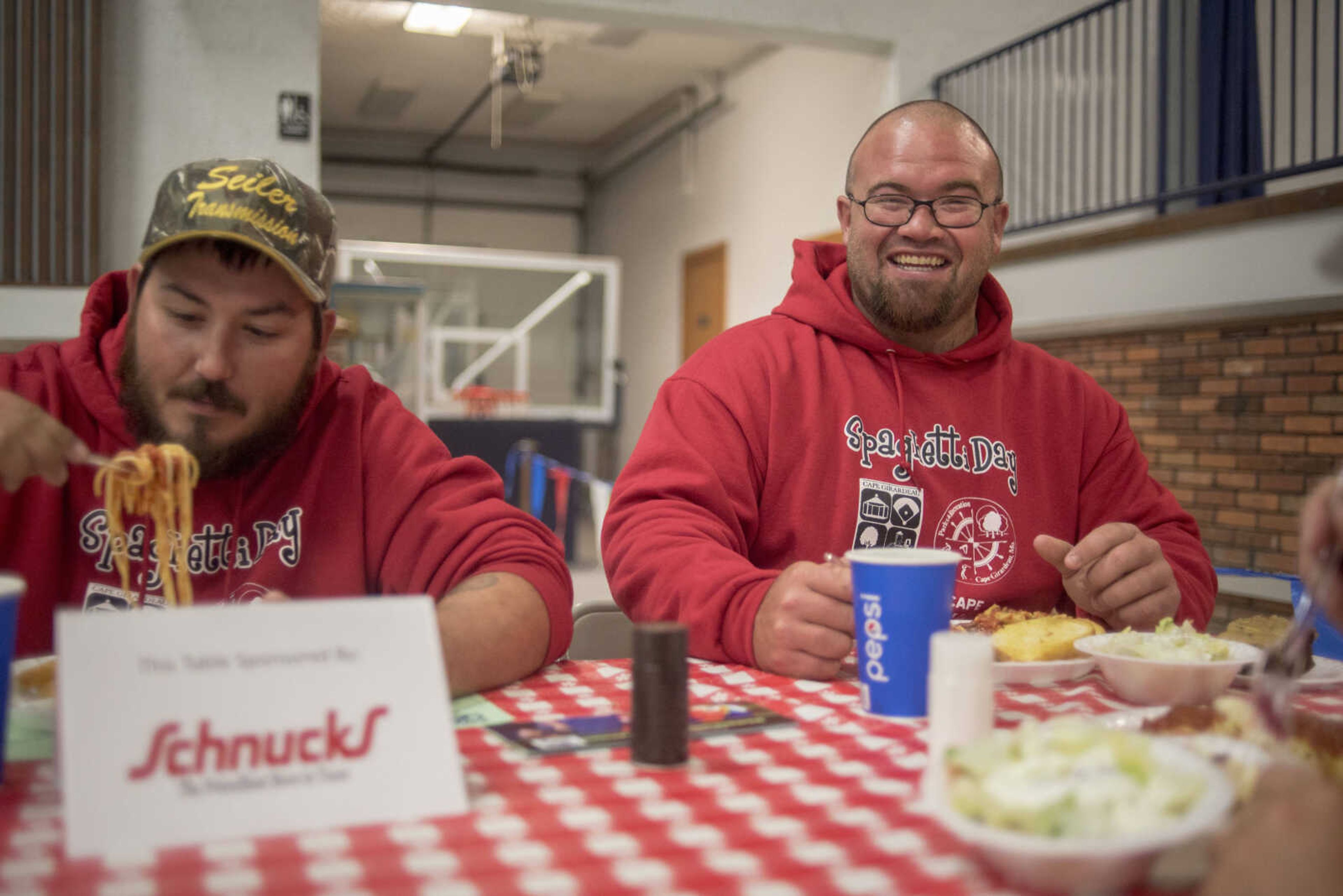 Zach Estes, right, and Elvin Stone enjoy lunch during the Parks & Recreation Foundation's Spaghetti Day Thursday, Nov. 7, 2019, at the A.C. Brase Arena building in Cape Girardeau.