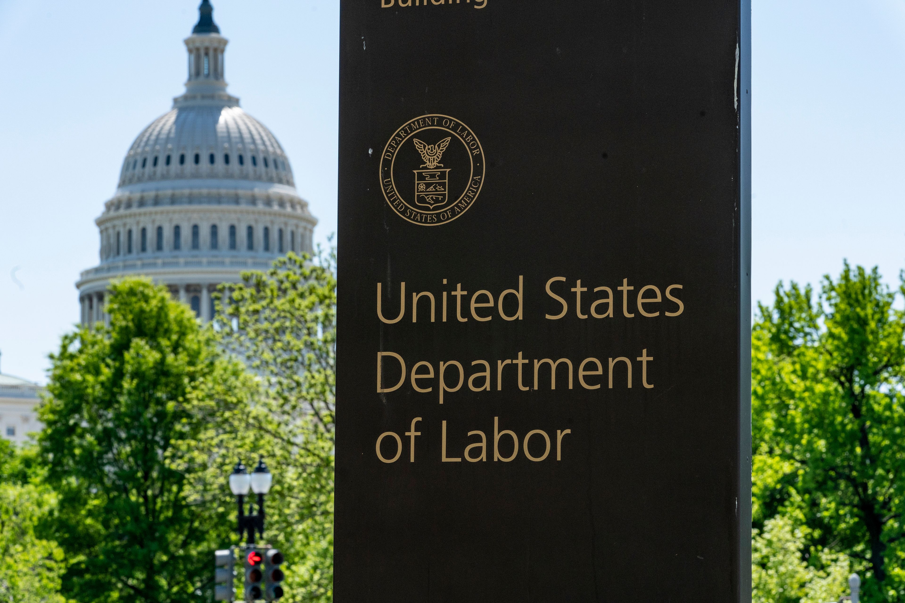 FILE - The entrance to the Labor Department is seen near the Capitol in Washington, May 7, 2020. (AP Photo/J. Scott Applewhite, File)