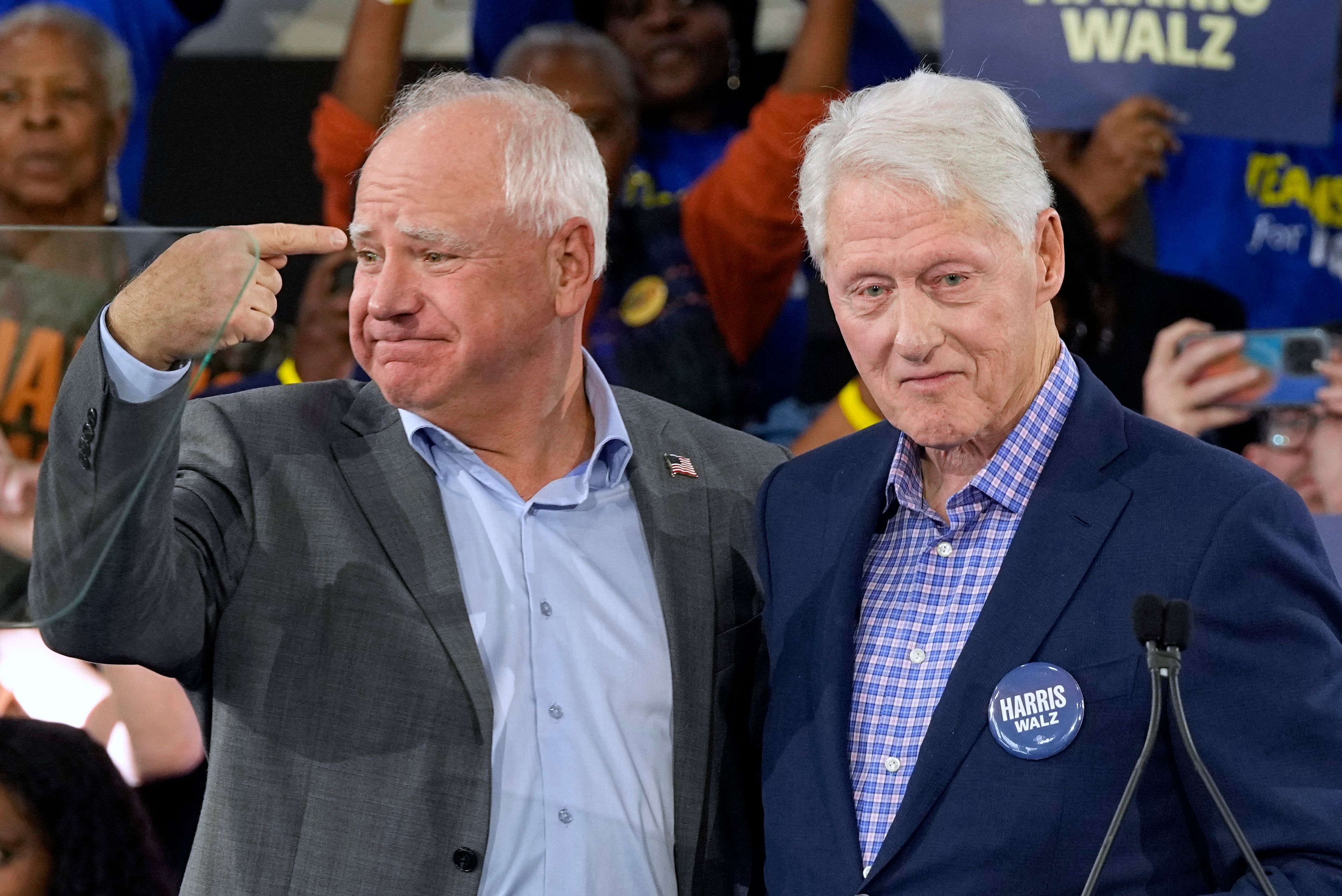 Democratic vice presidential nominee Minnesota Gov. Tim Walz appears with former President Bill Clinton at a campaign rally in Durham, N.C., Thursday, Oct. 17, 2024. (AP Photo/Steve Helber)