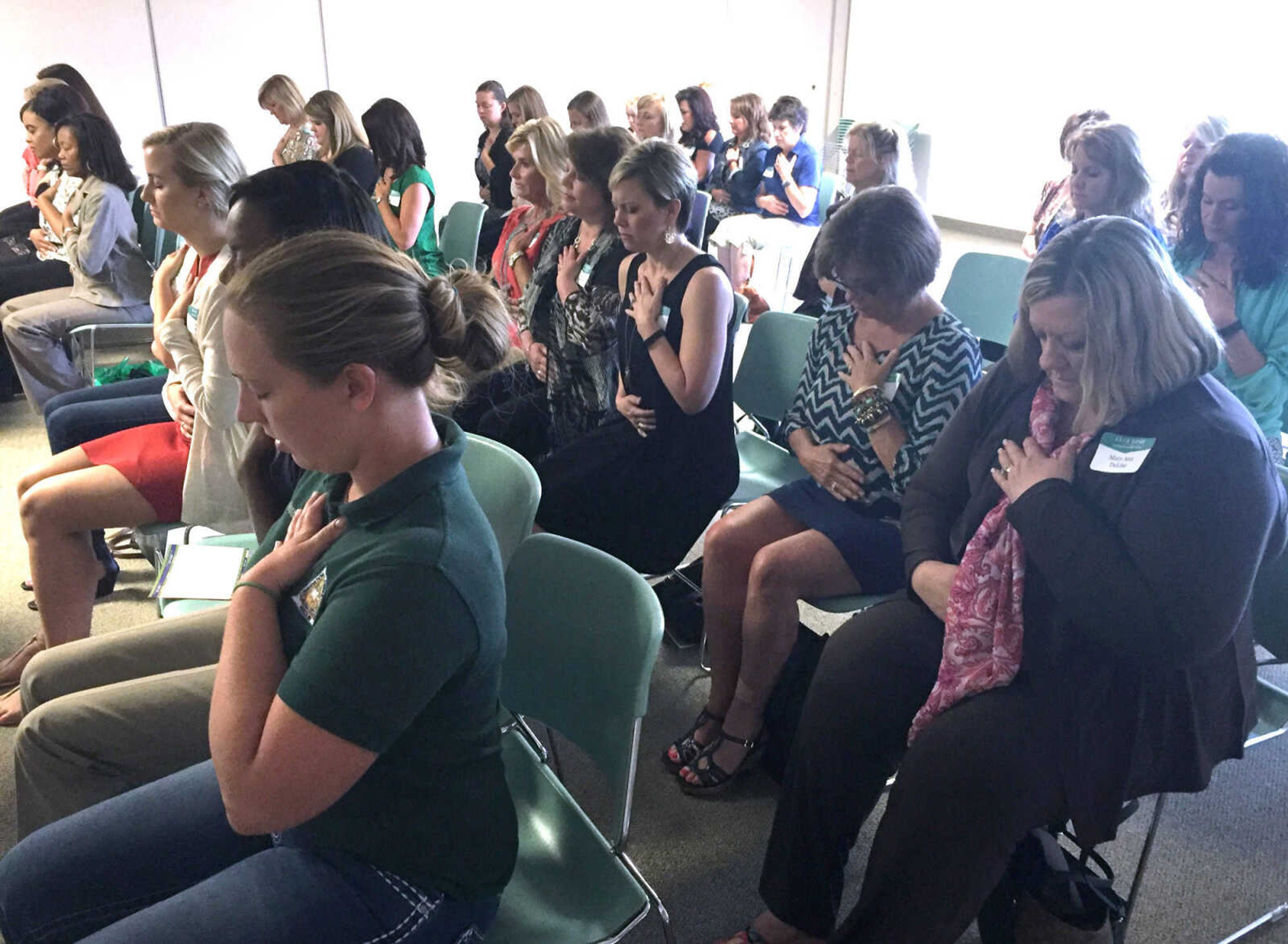 BRIDGET BROWN ~ bbrown@semissourian.com
Women attending the Healthy Living breakout session at the Flourish Women's Summit were guided through seated yoga stretches Thursday, Aug. 25, 2016 at the Osage Centre.