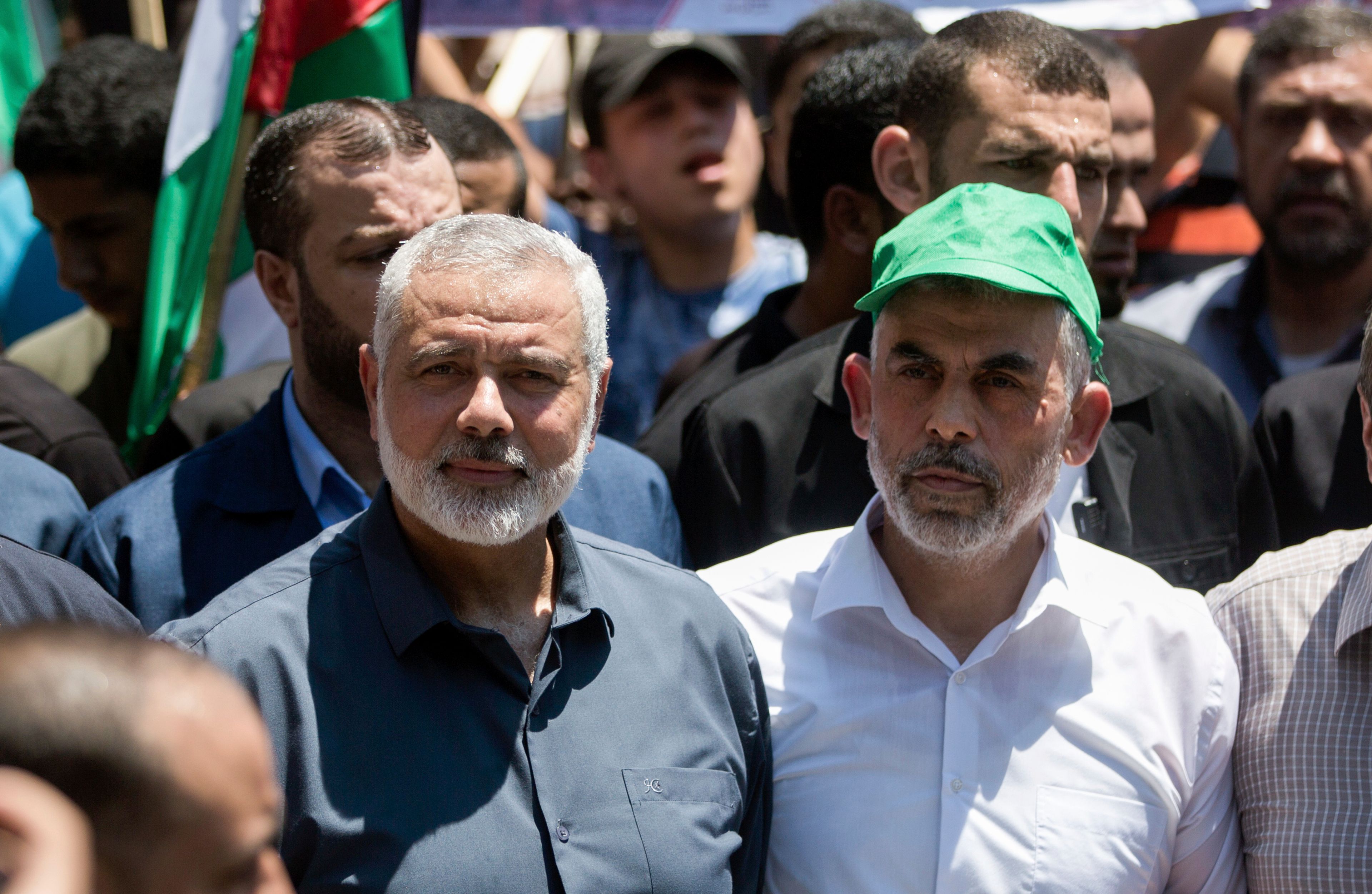 FILE - Head of the Hamas political bureau, Ismail Haniyeh, left, and Hamas leader in the Gaza Strip Yahya Sinwar attend a protest in Gaza City on June 26, 2019. (AP Photo/Khalil Hamra, File)