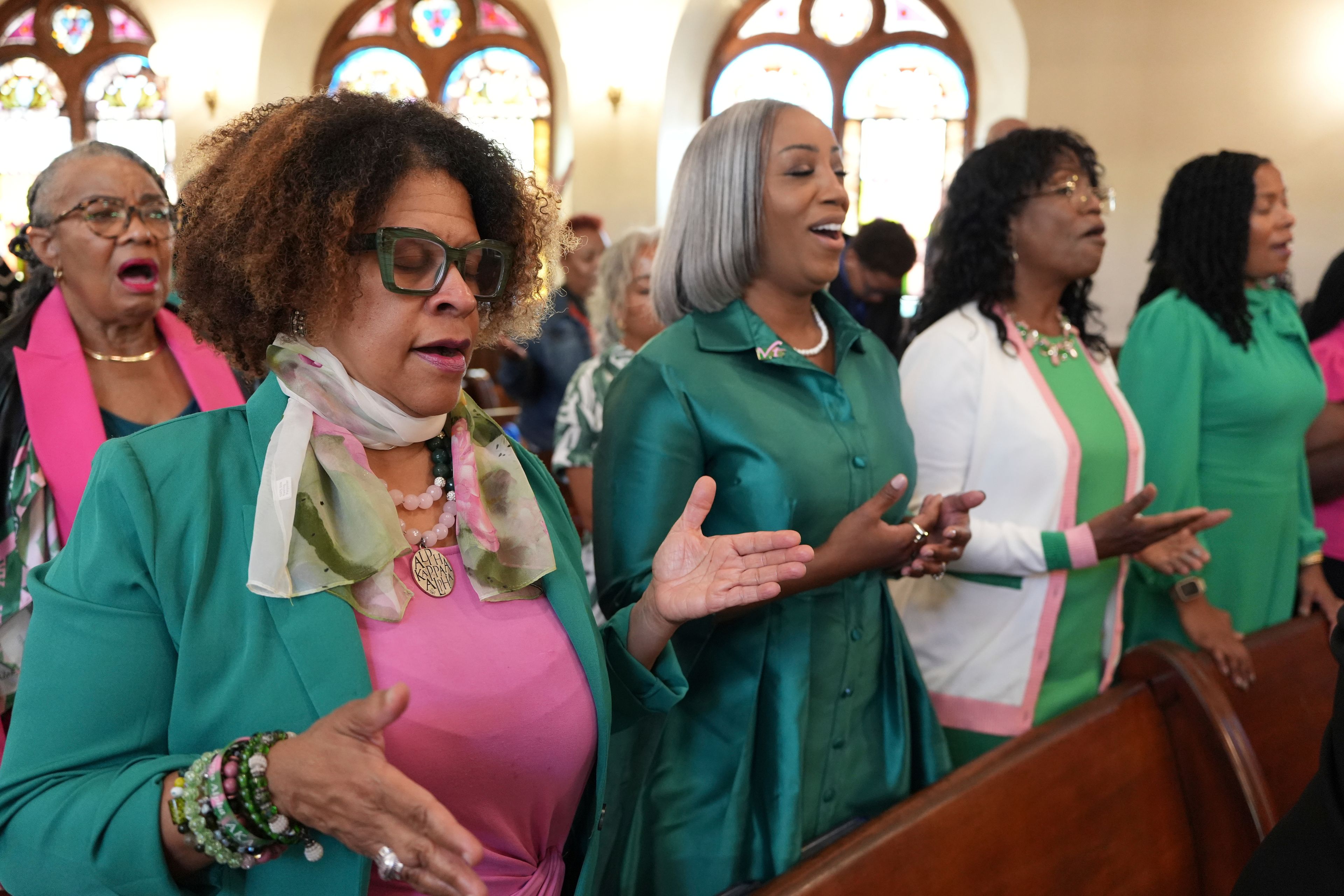 Members of the Alpha Kappa Alpha Sorority, Omega Mu Omega chapter, worship during a service at Mother Bethel AME Church in Philadelphia on Sunday, Oct. 13, 2024. (AP Photo/Luis Andres Henao)