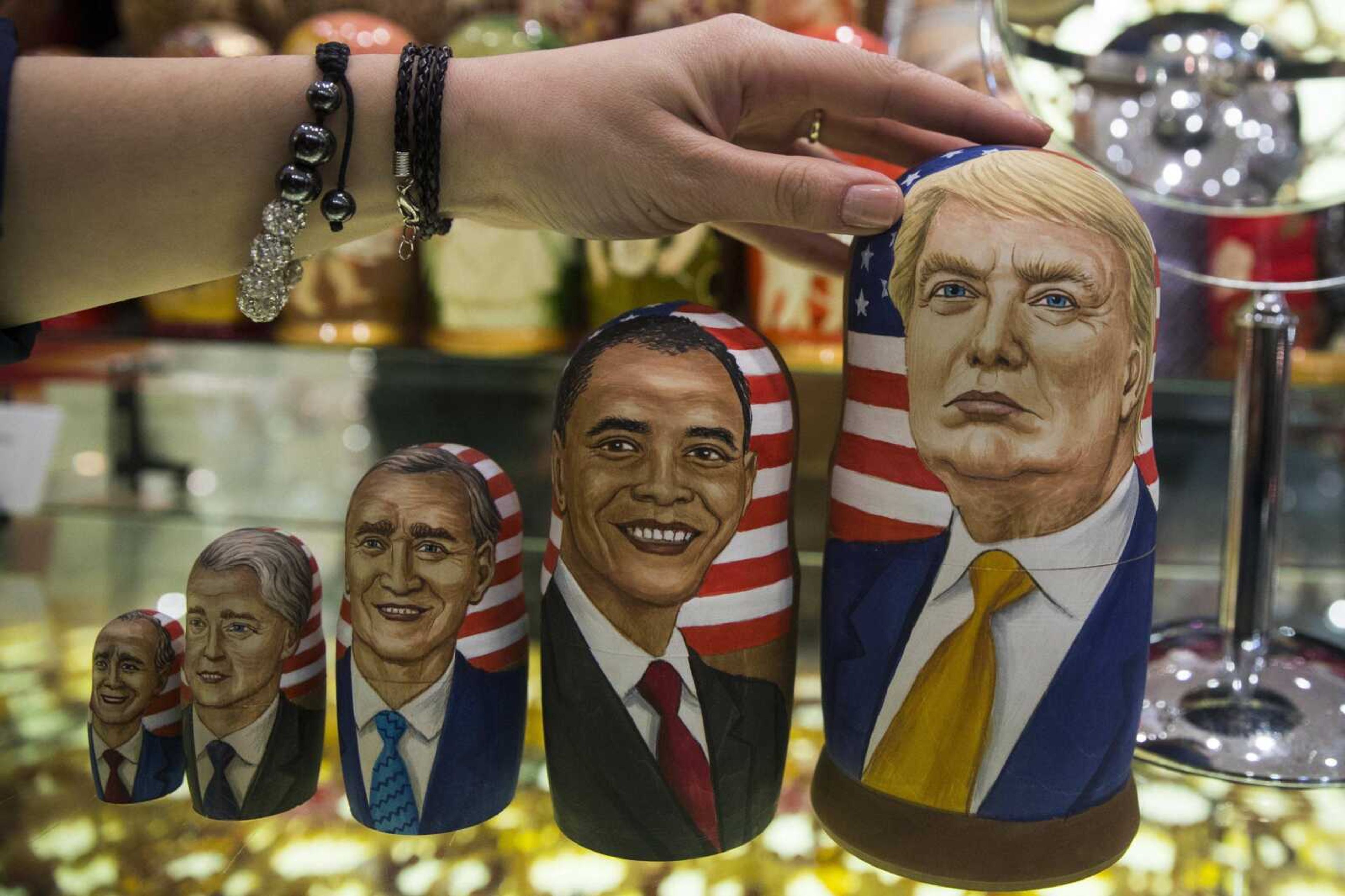 Traditional Russian wooden nesting dolls called Matreska depicting U.S. presidents, from left, George H.W. Bush, Bill Clinton, George W. Bush, Barack Obama and then-presidential candidate Donald Trump, are displayed in a shop Nov. 8 in Moscow. Hacked emails, disclosed by WikiLeaks, revealed sometimes embarrassing details from Democratic Party operatives in the run-up to Election Day. The CIA later concluded Russia was behind the hacking in a bid to boost Donald Trump's chances of beating Hillary Clinton.