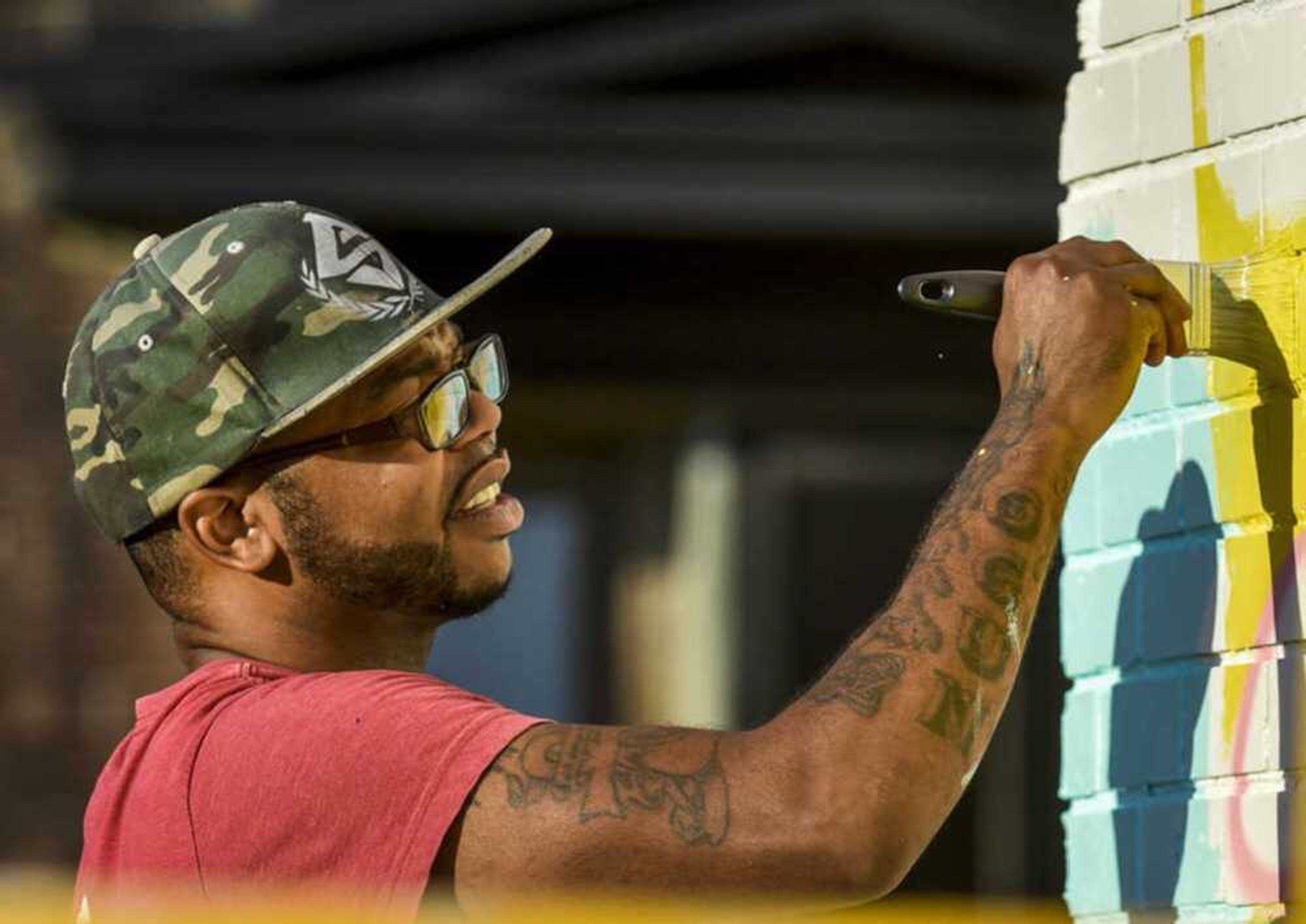 Malcolm McCrae paints the mural on the side of the One City building in 2018 in Cape Girardeau.