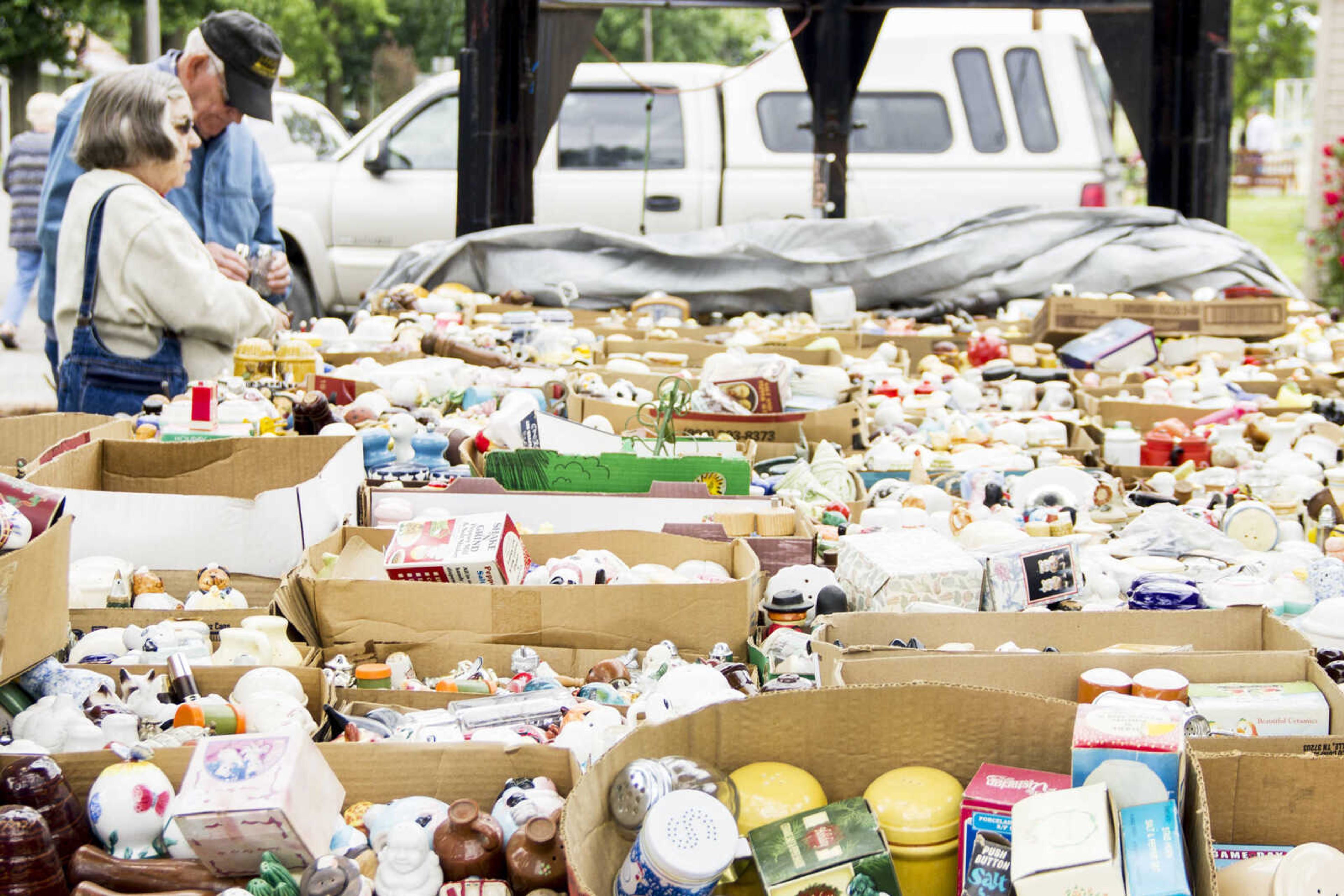 CAROL KELLISON ~ photo@semissourian.com

Martha and Carney Lovett browse through a large collection of salt and pepper shakers at the 100-mile sale on Thursday, May 22,  2015 in Delta, Missouri.