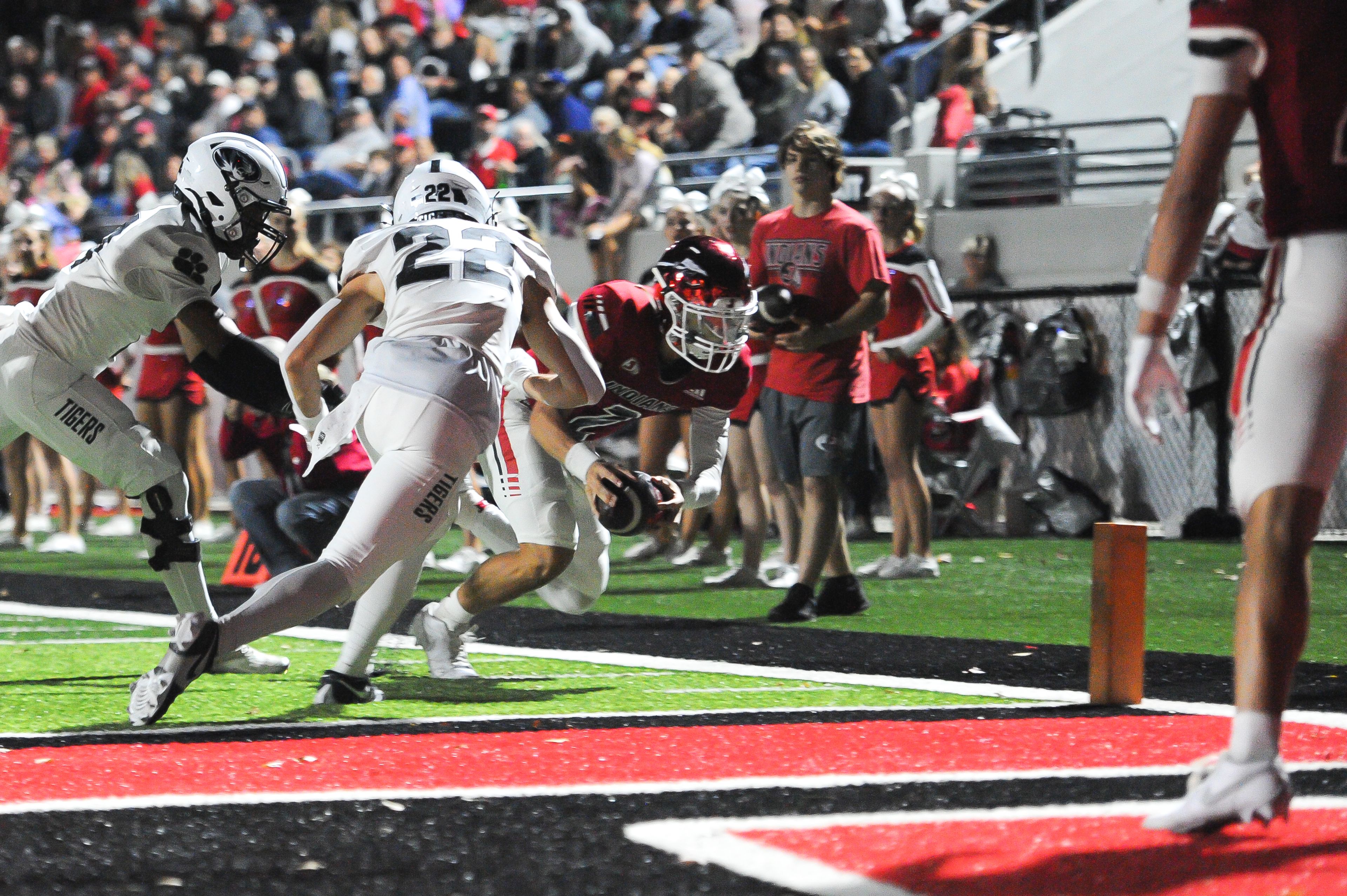 Jackson's Drew Parsons dives for the pylon during a Friday, October 25, 2024 game between the Jackson Indians and the Festus Tigers at "The Pit" in Jackson, Mo. Jackson defeated Festus, 43-7.