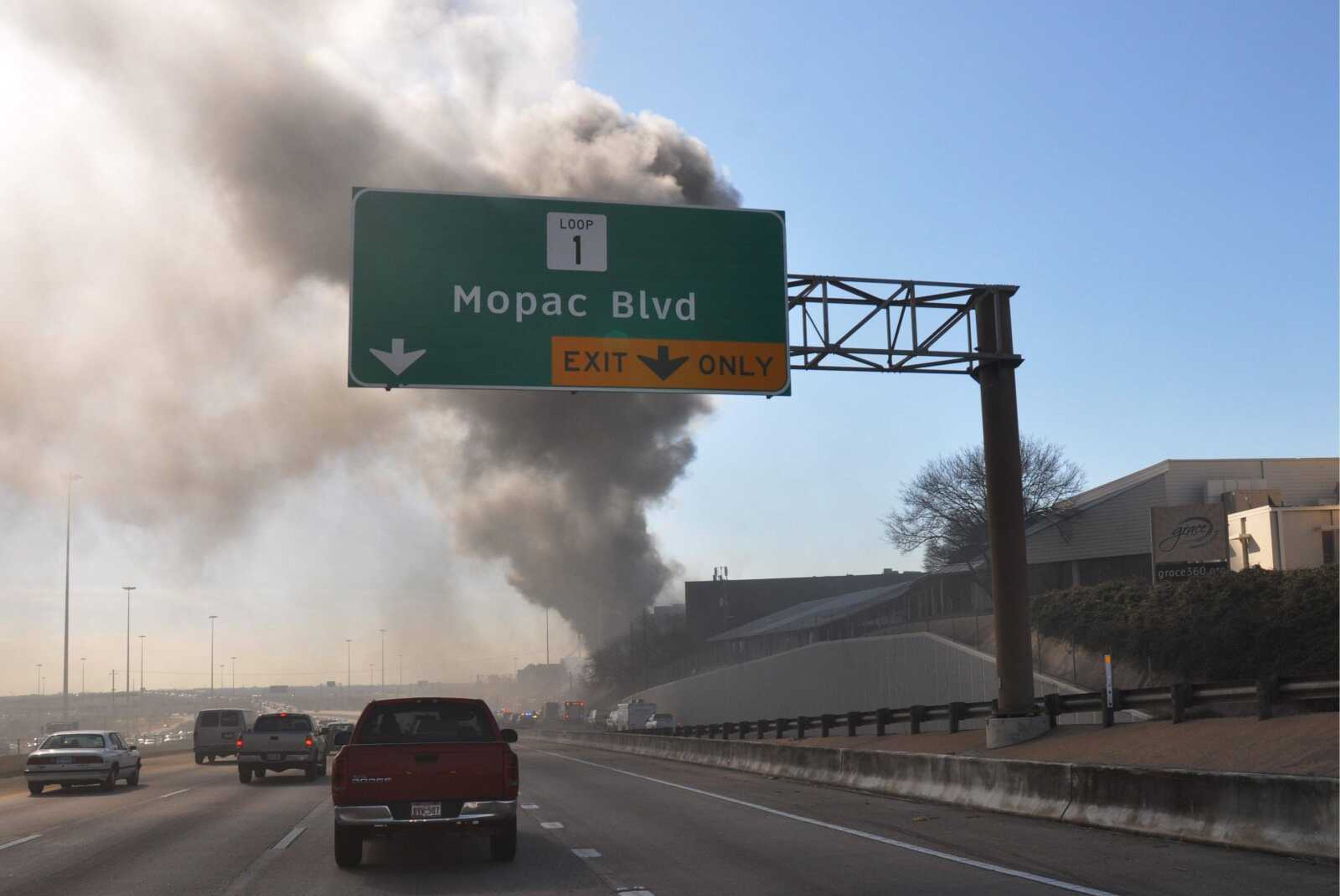 In this photo provided by Trey Jones, smoke billows from a seven-story building  in Austin, Texas after a small private plane crashed into it Thursday Feb. 18, 2010. (AP Photo/Trey Jones)