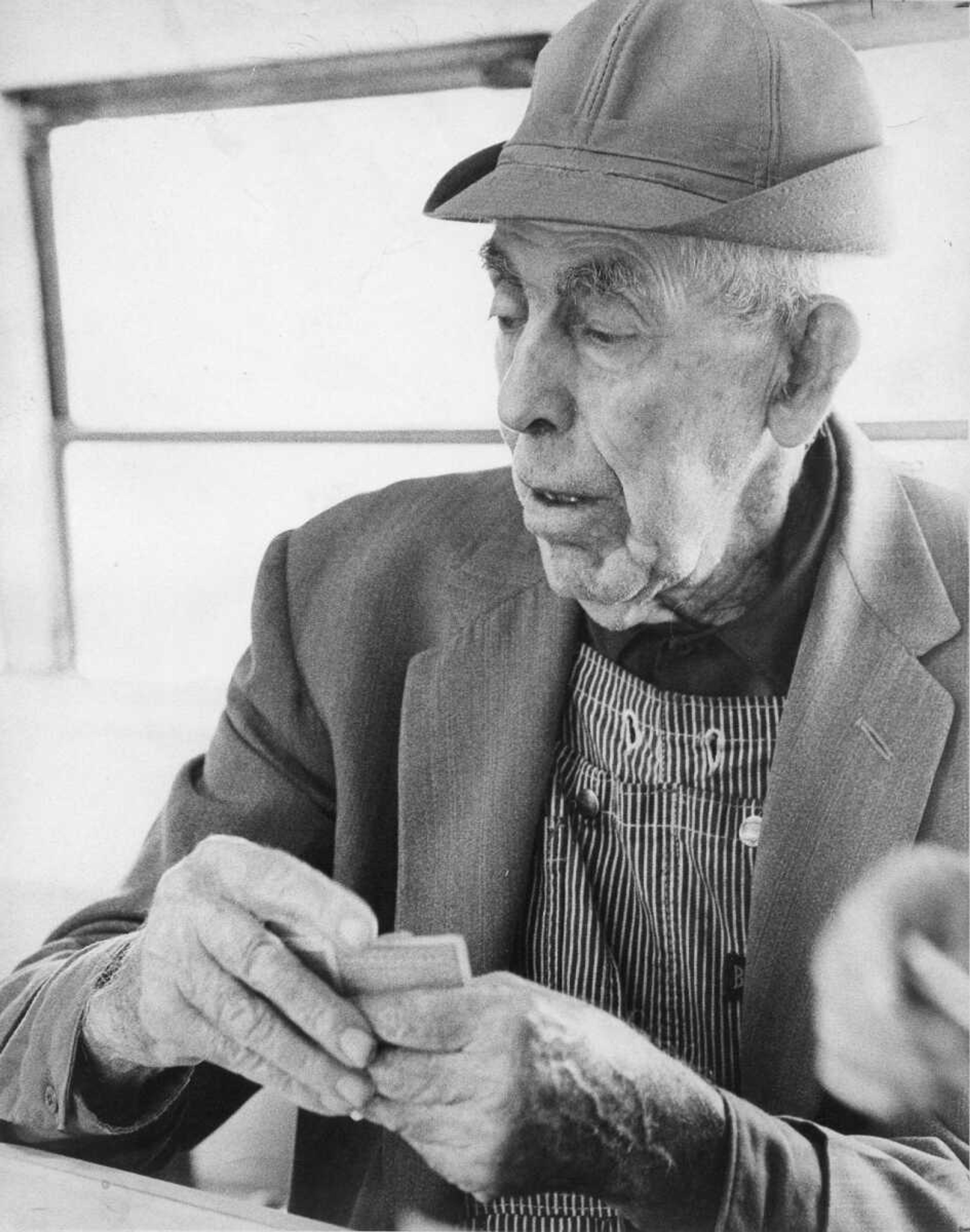 Published April 4, 1979.
An old school bus at Kelso was converted into a club room for a group of local men, who met there daily to play cards. Frank Glueck was one of the card players. (Phil Nash ~ Southeast Missourian archive)