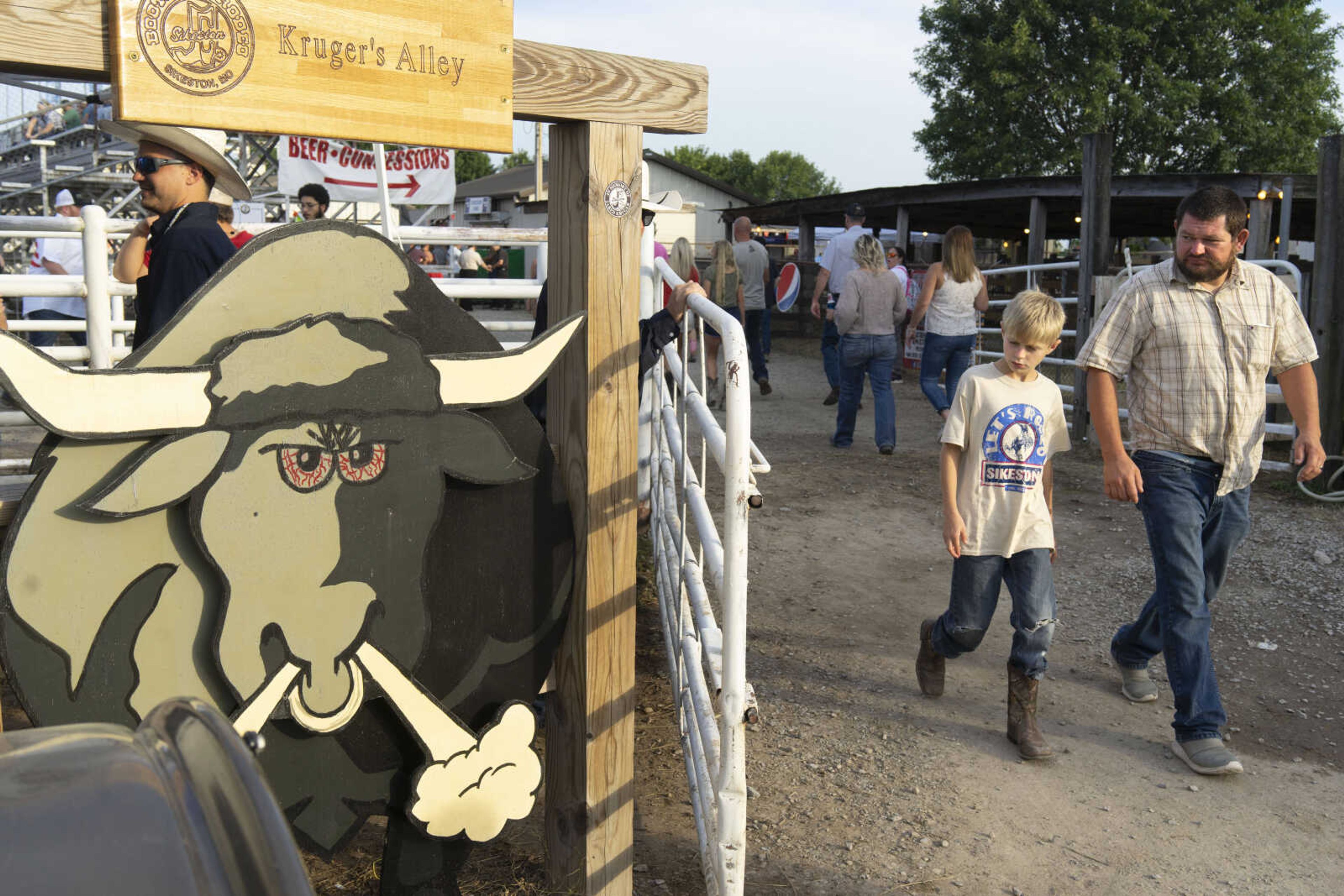 Spectators pass KrugerГўв‚¬в„ўs Alley shortly before the last night of the Sikeston Jaycee Bootheel Rodeo Saturday, Aug. 14, 2021,&nbsp;in Sikeston, Missouri.