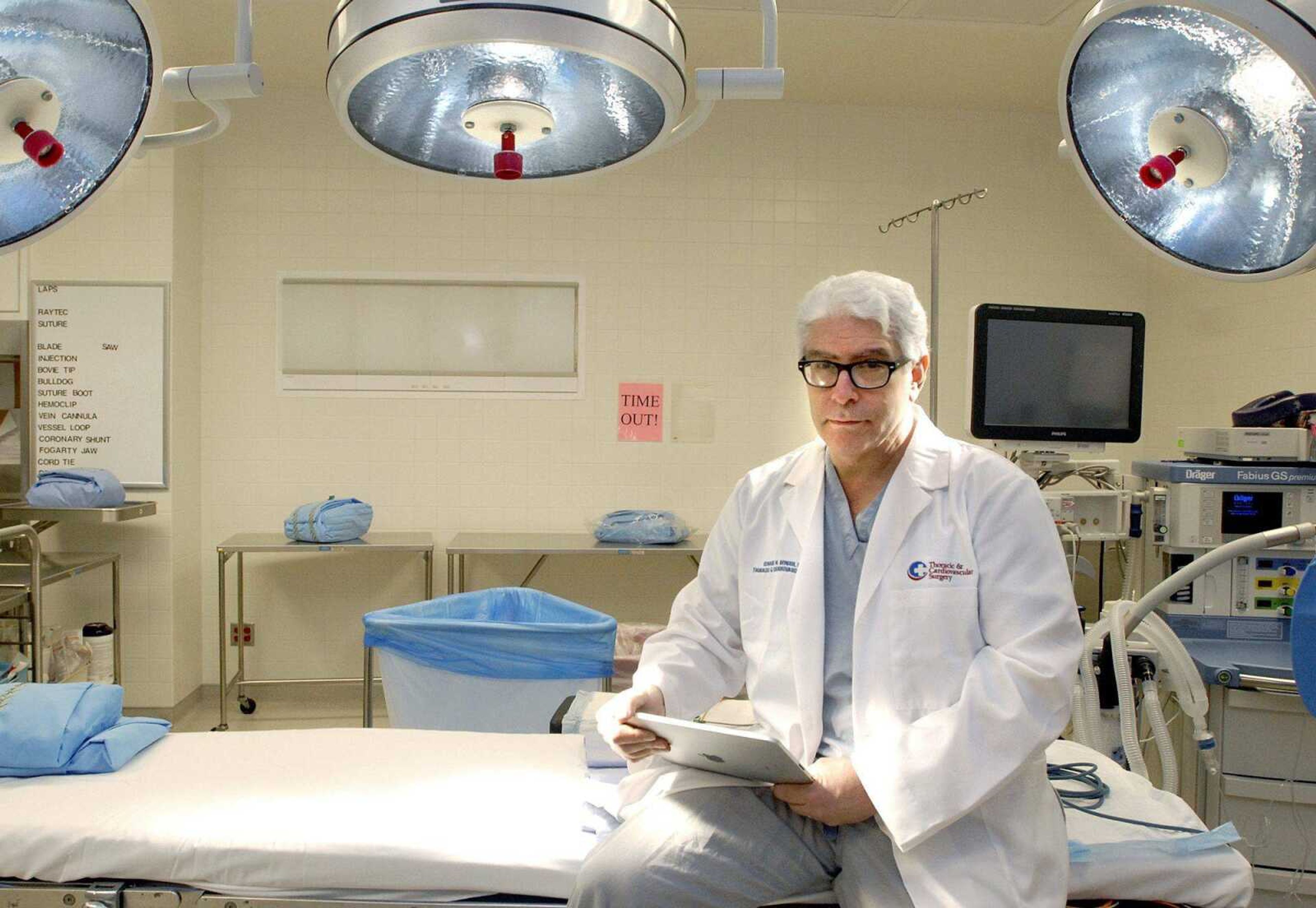 Dr. Edward M. Bender poses with his iPad inside an operating room at Saint Francis Medical Center in Cape Girardeau. (file photo)