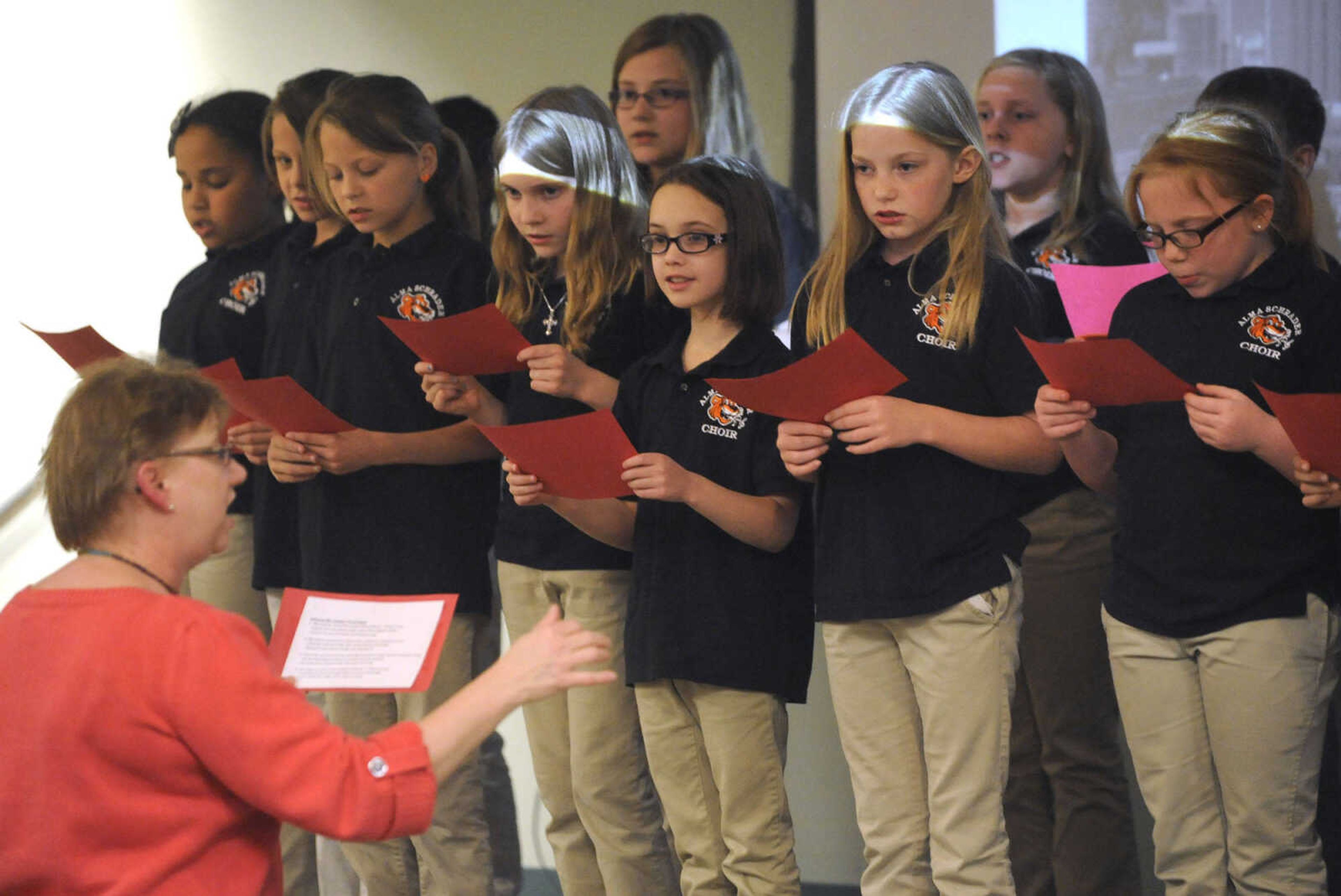 Rebecca Gentry directs the Alma Schrader Elementary Choir during the Girardeau Law Enforcement Appreciation Day program Tuesday, April 21, 2015.