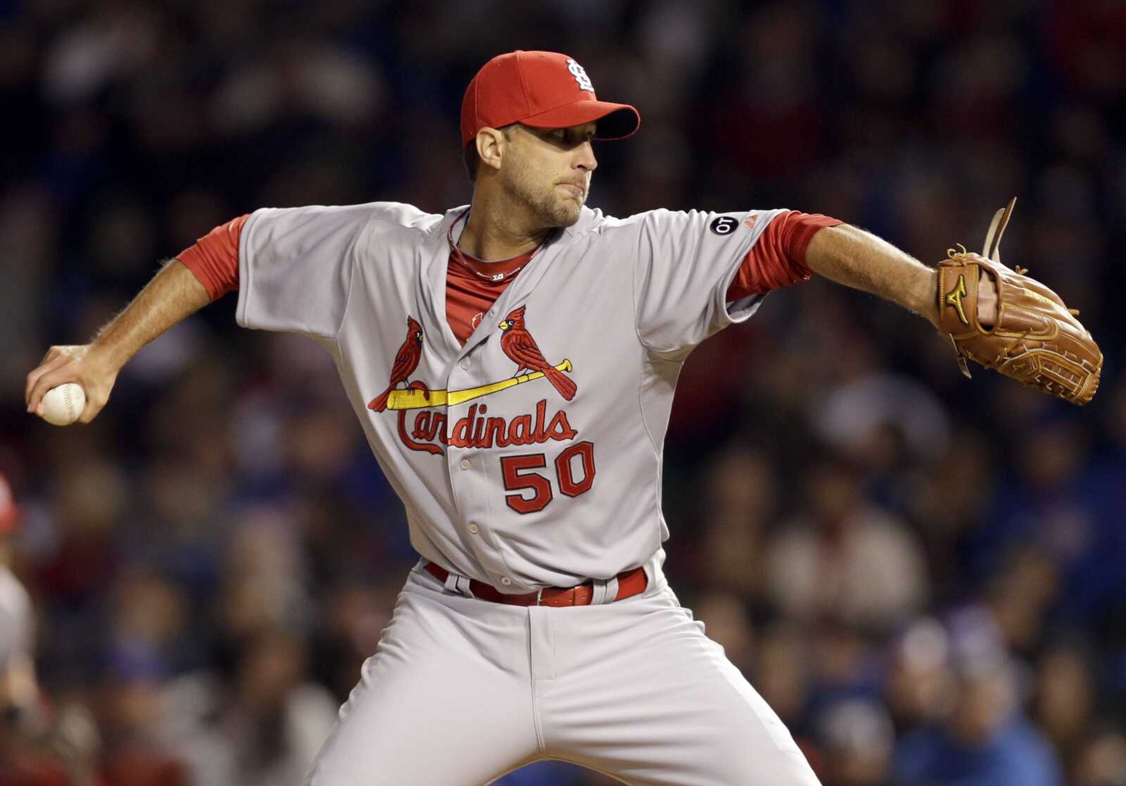 St. Louis Cardinals starter Adam Wainwright throws against the Chicago Cubs during the third inning of a Major League Baseball season-opening game in Chicago, Sunday, April 5, 2015. (AP Photo/Nam Y. Huh)