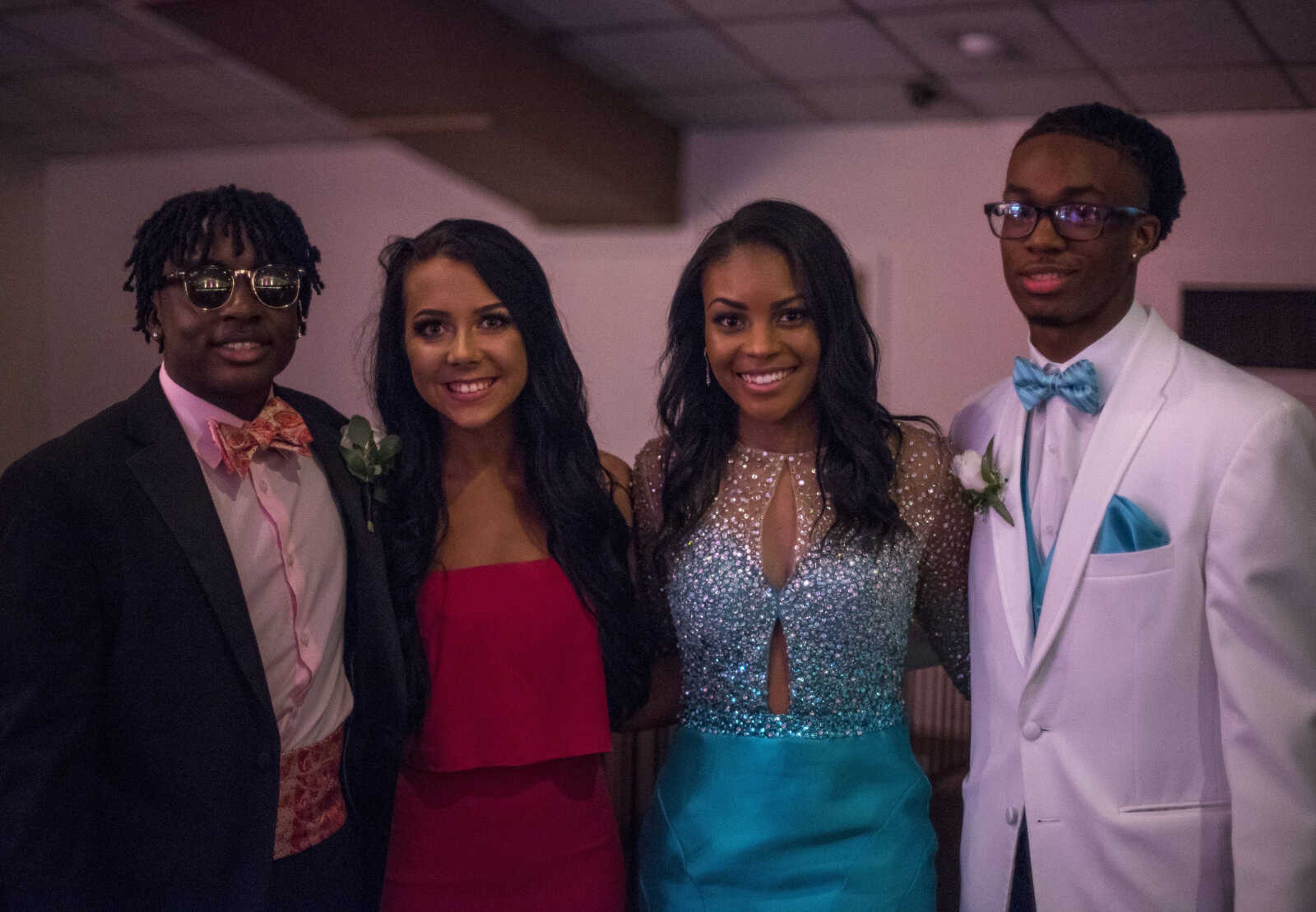 From left, Tyrus Reddin, Maggie Grimm, Jaeda Easley, and Chauncey Hughes pose for a photograph during Cape Central High School Prom Saturday, April 27, 2019, at Ray's Banquet Center in Cape Girardeau.