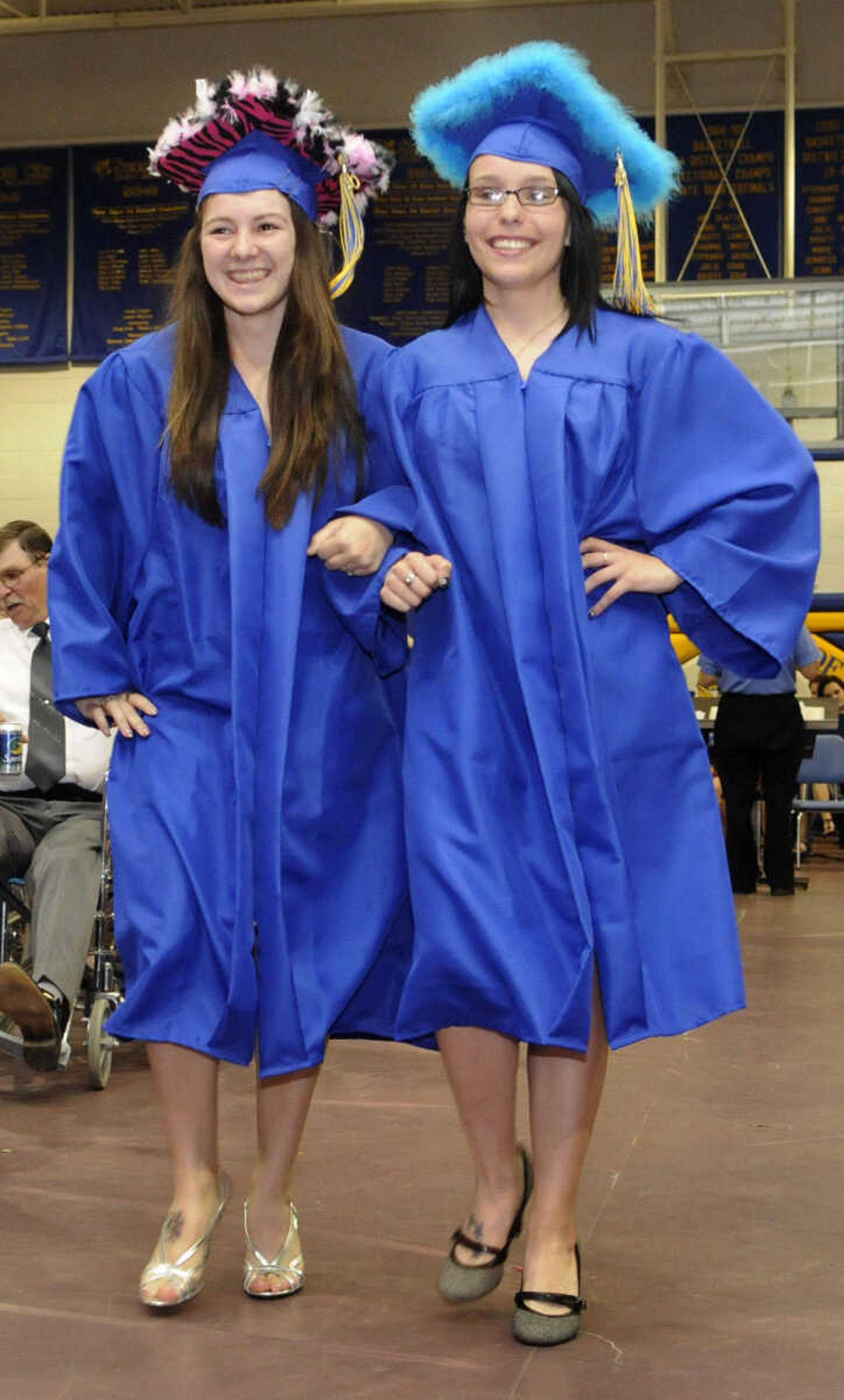 KRISTIN EBERTS ~ keberts@semissourian.com

Alexis Whitmore, left, and Katrina Schiwitz walk in during the processional during Scott City High School's 2010 Commencement in the school gym on Sunday, May 23.