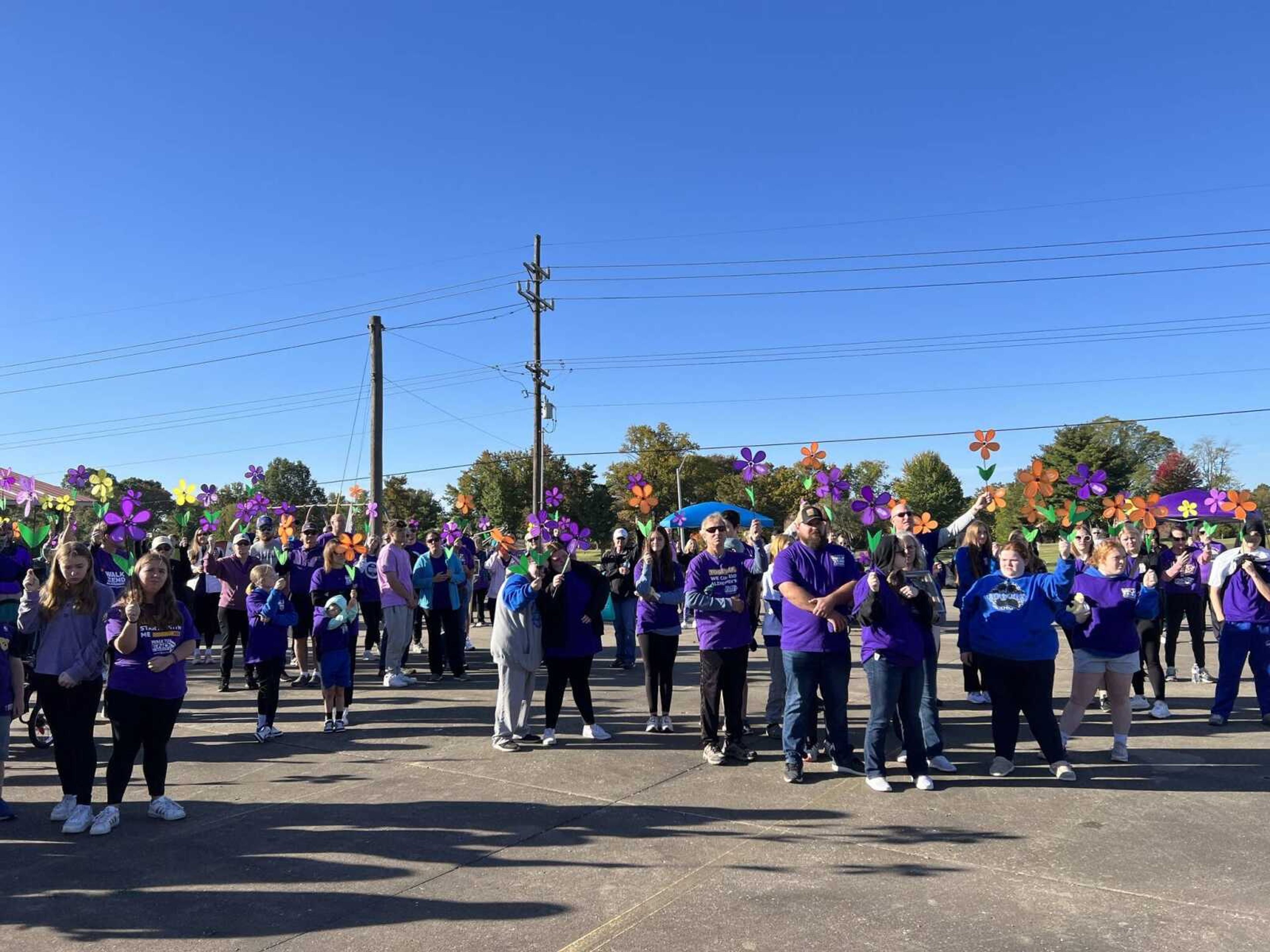 People gather for the Walk to End Alzheimer's. The walk is a fundraising event held by the Alzheimer's Association.