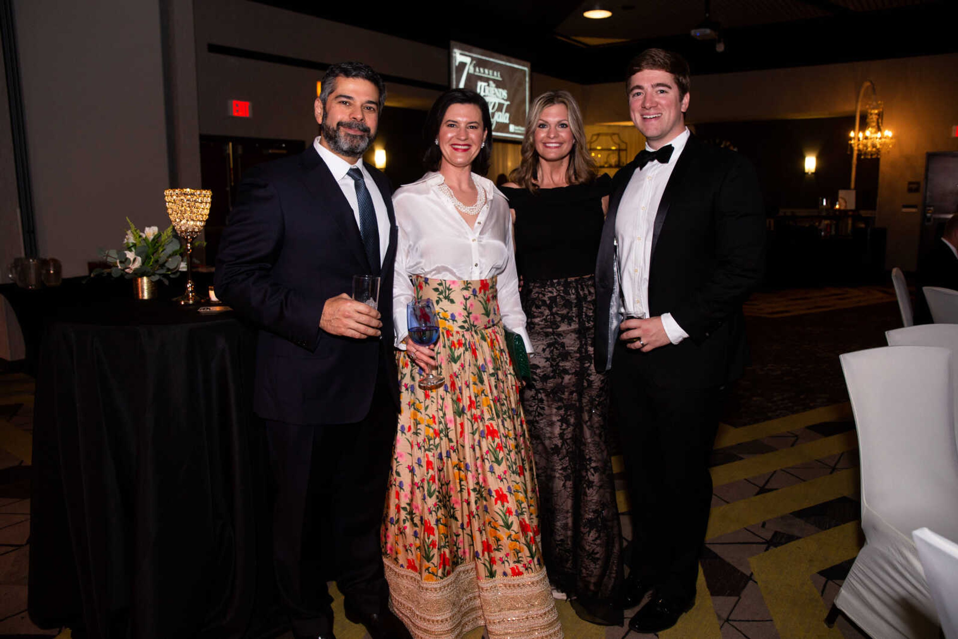 Dr. Kev. Gamadia and Dr. Sara Nowicki-Gamadia pose with Evan and Caroline Ritter at the gala.