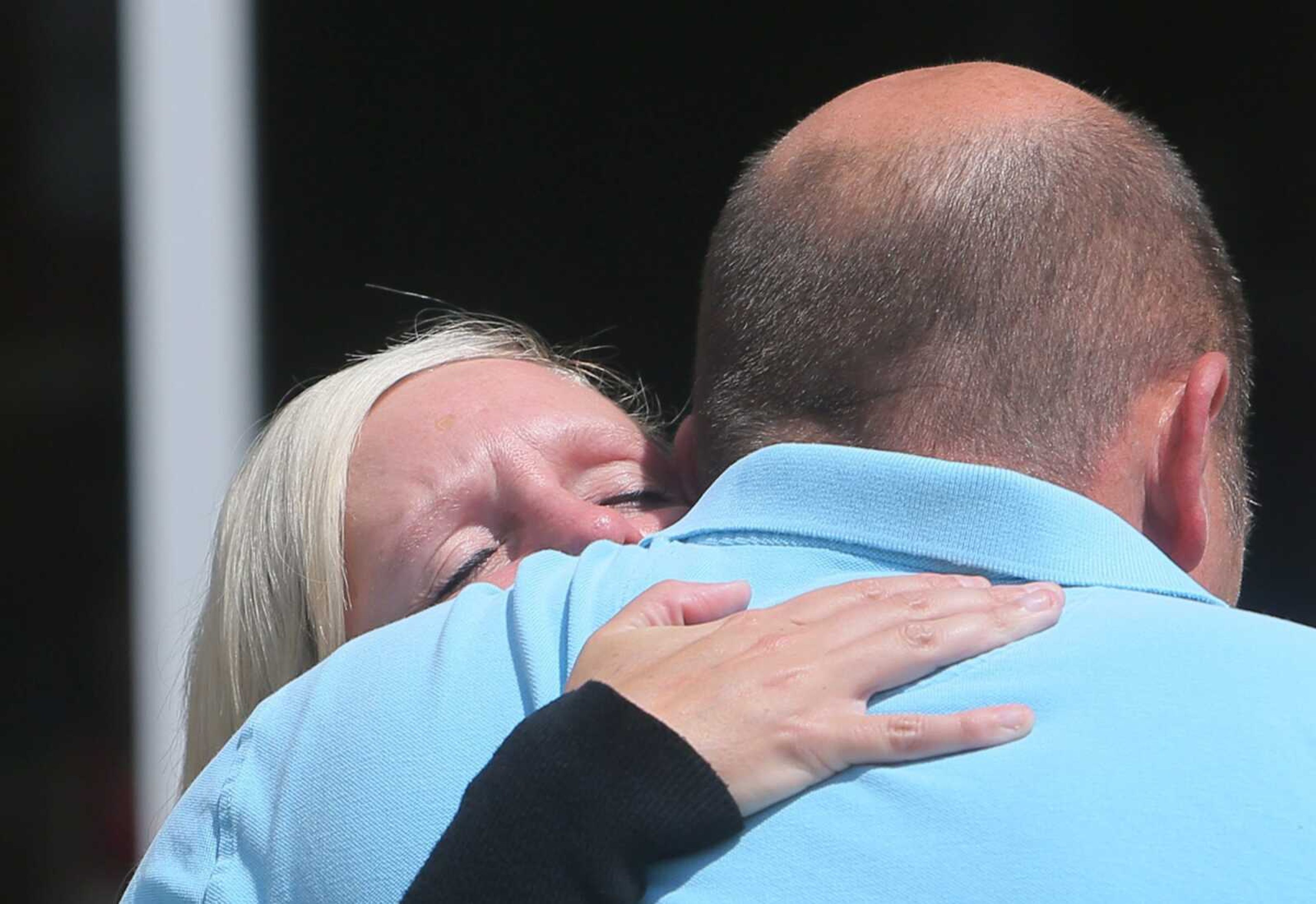 Krystal Conn hugs her husband Monday outside the St. Charles County Courthouse in St. Charles, Missouri, after the sentencing of Pamela Hupp for the murder of Louis Gumpenberger, Conn's half brother. Hupp was sentenced to life in prison.