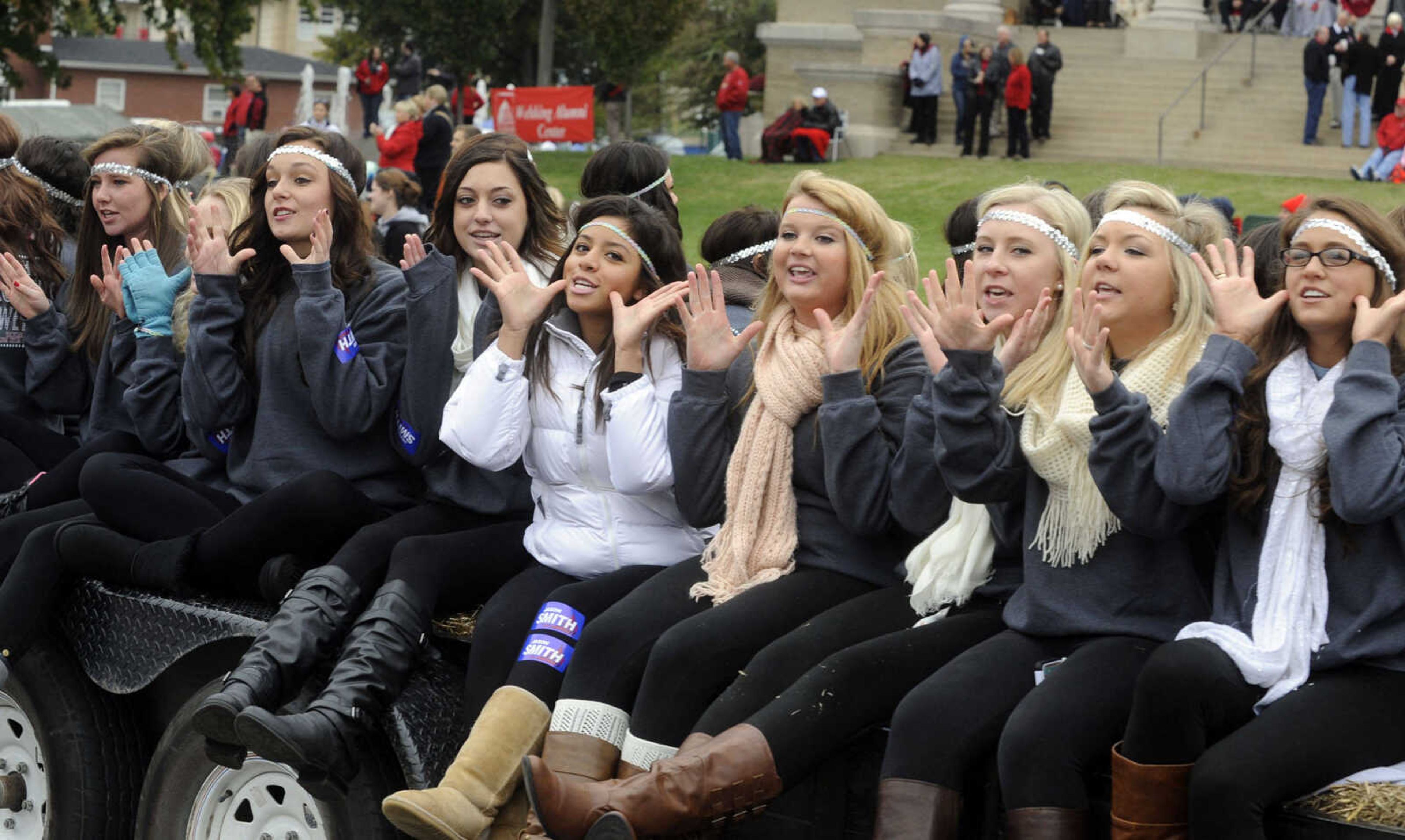 Alpha Delta Pi members ride in the SEMO Homecoming parade Saturday, Oct. 26, 2013 on Broadway in Cape Girardeau.