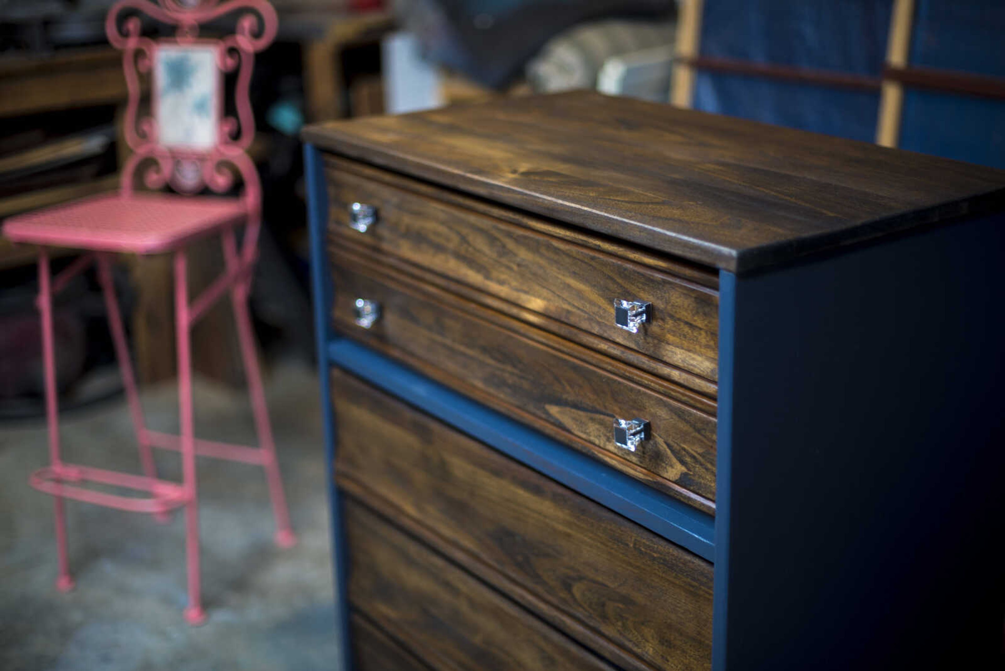 A chair and dresser is seen of other projects Debbie Birk is working on in her garage Wednesday, July 26, 2017 in Jackson. Birk has the nickname The Junkin' Gal, she likes to look for what other people find as junk and redesign it to look completely different.