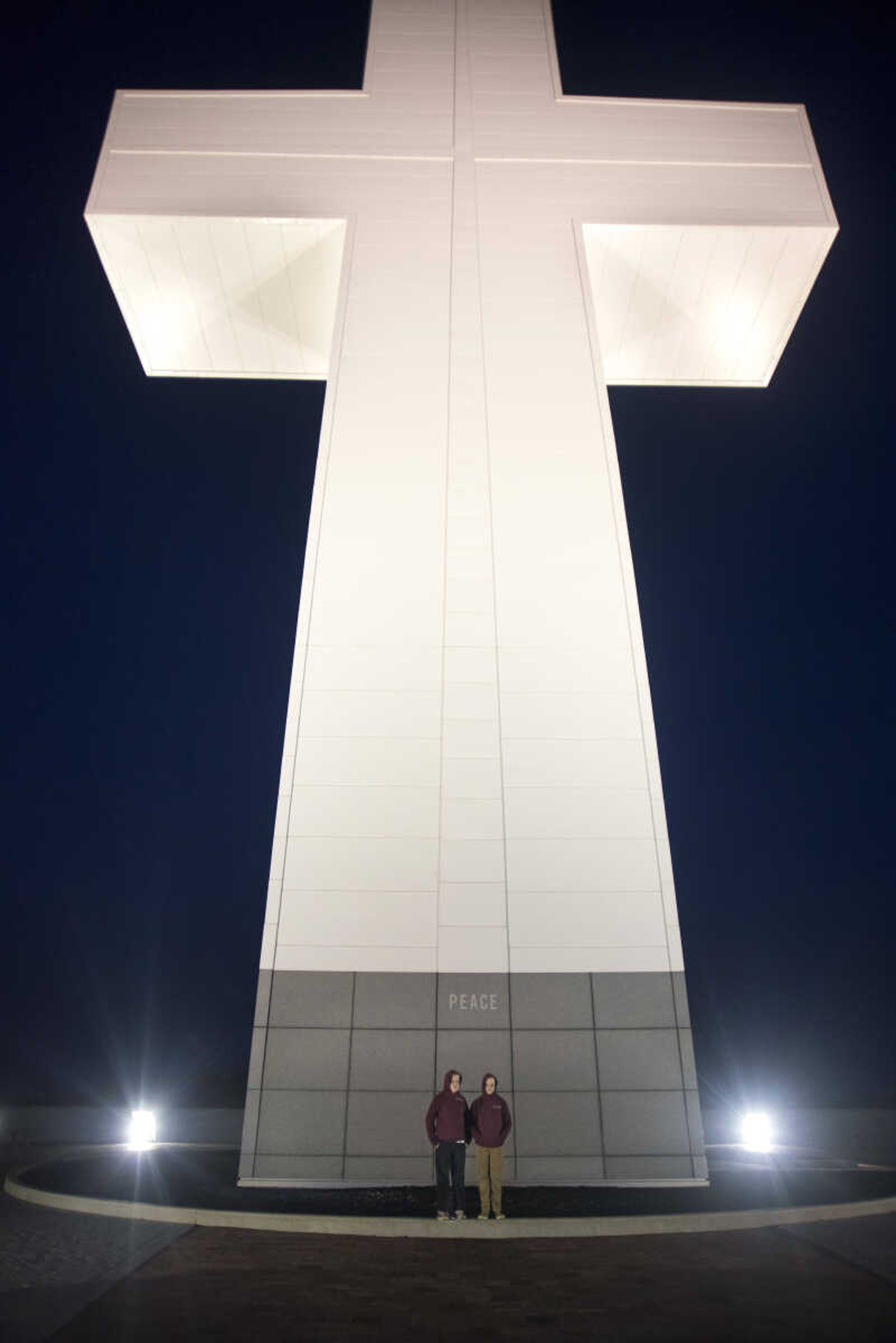 Ben Willis, 11, and his twin brother Jacob pose for a photo in front of the Bald Knob Cross of Peace during the 81st annual Easter Sunrise Service Sunday, April 16, 2017 in Alto Pass, Illinois.