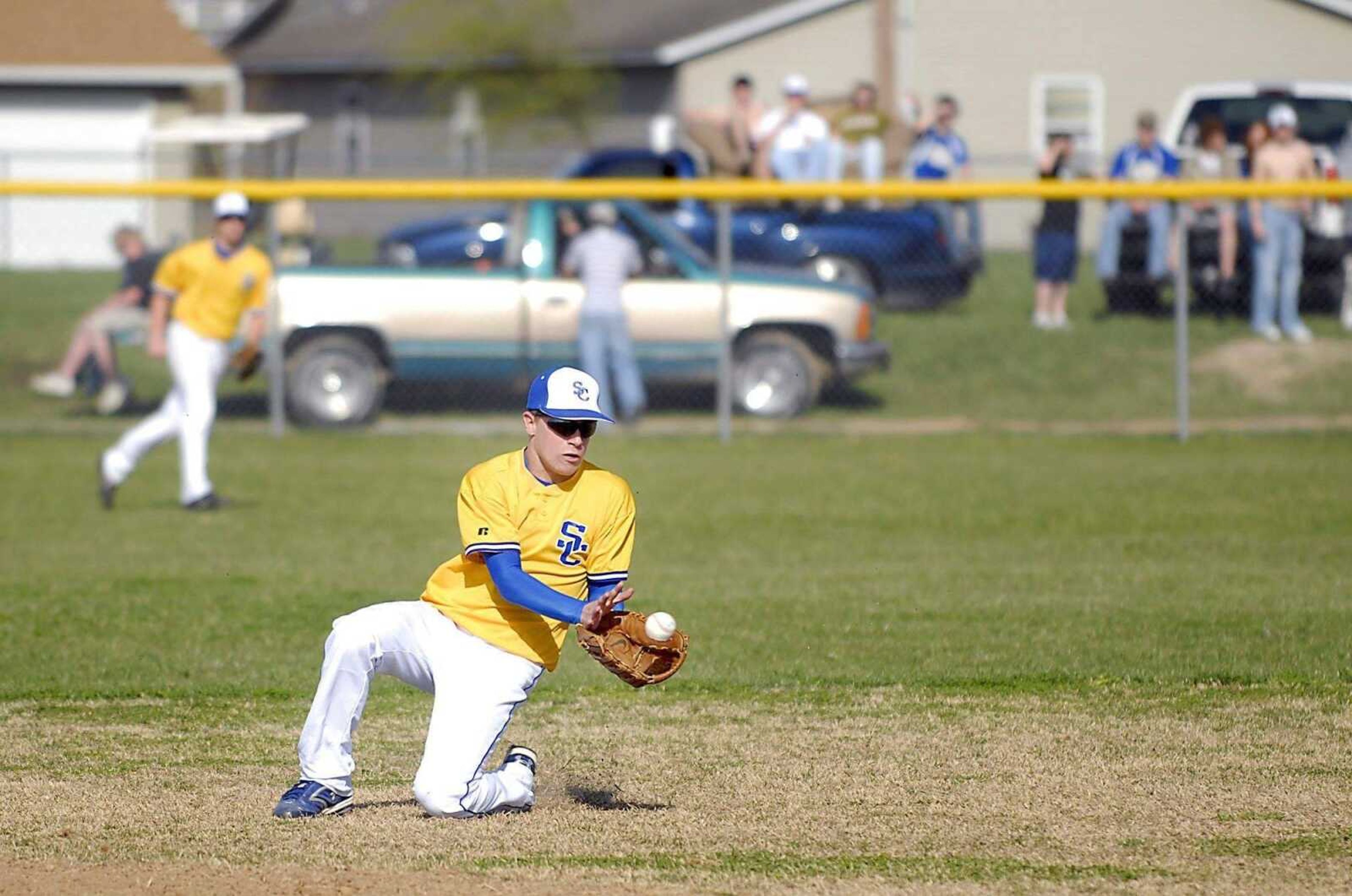 KIT DOYLE ~ kdoyle@semissourian.comScott City second baseman Justin Modglin scoops up a grounder Monday, March 23, 2009, in Scott City.