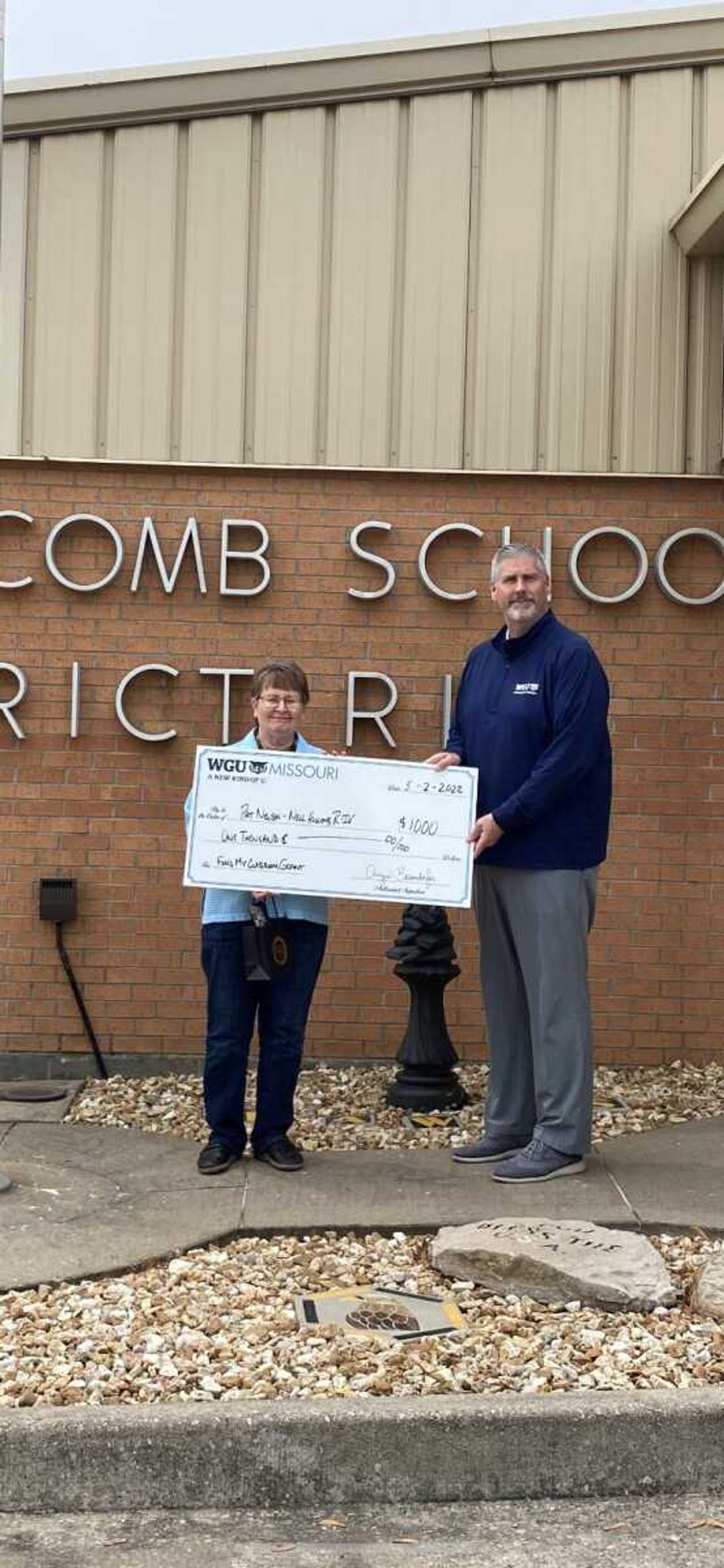 WGU Missouri Strategic Partnerships Manager Jim Chandler surprised Pat Nelson, K-8 librarian at Nell Holcomb School in Cape Girardeau, with a "Fund My Classroom" grant for $1,000 in early May. 