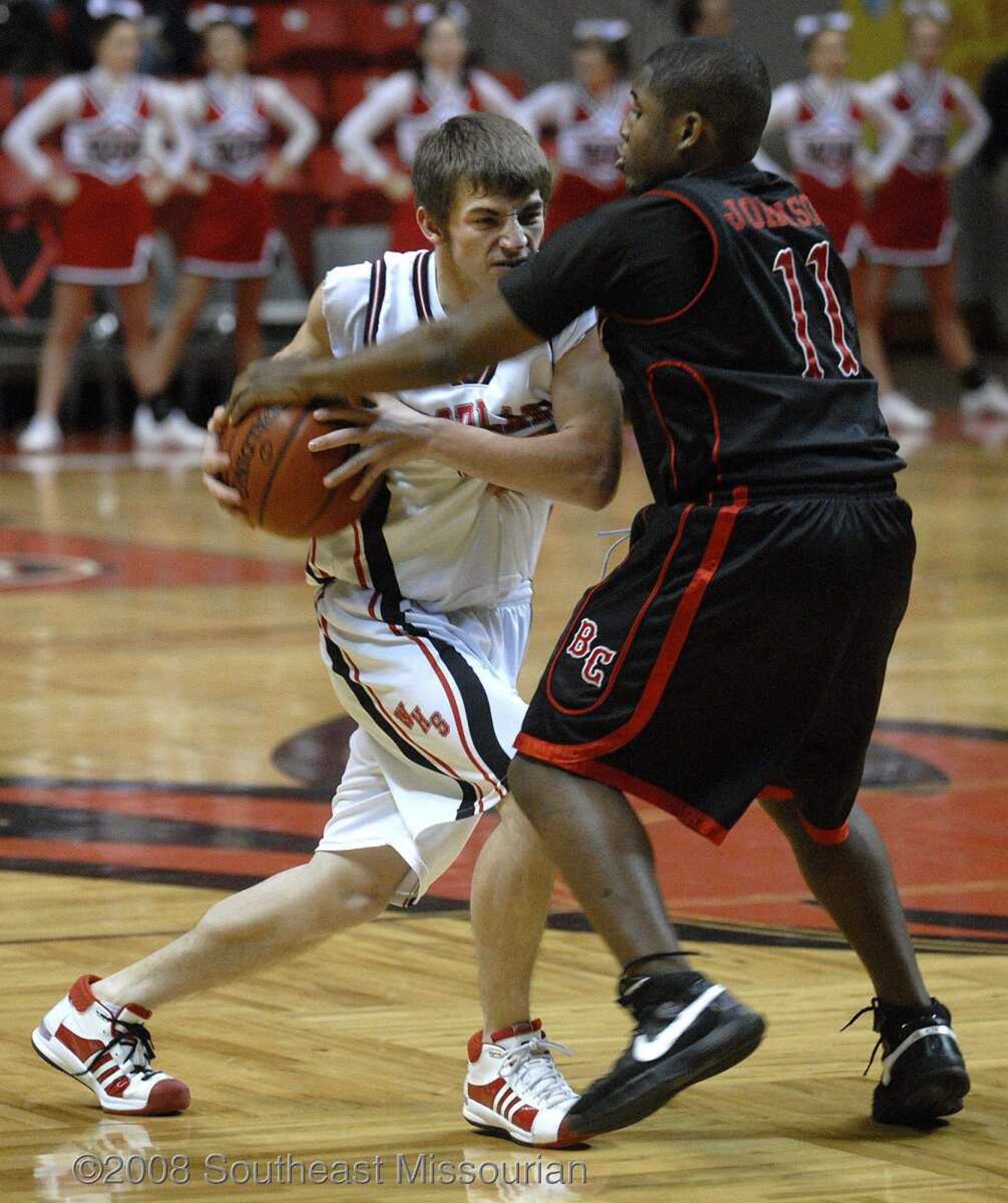 FRED LYNCH ~ flynch@semissourian.com
Woodland's Corey Chapman is stopped by Bell City's Melvin Johnson during the first quarter in Southeast Missourian Christmas Tournament Saturday at the Show Me Center.