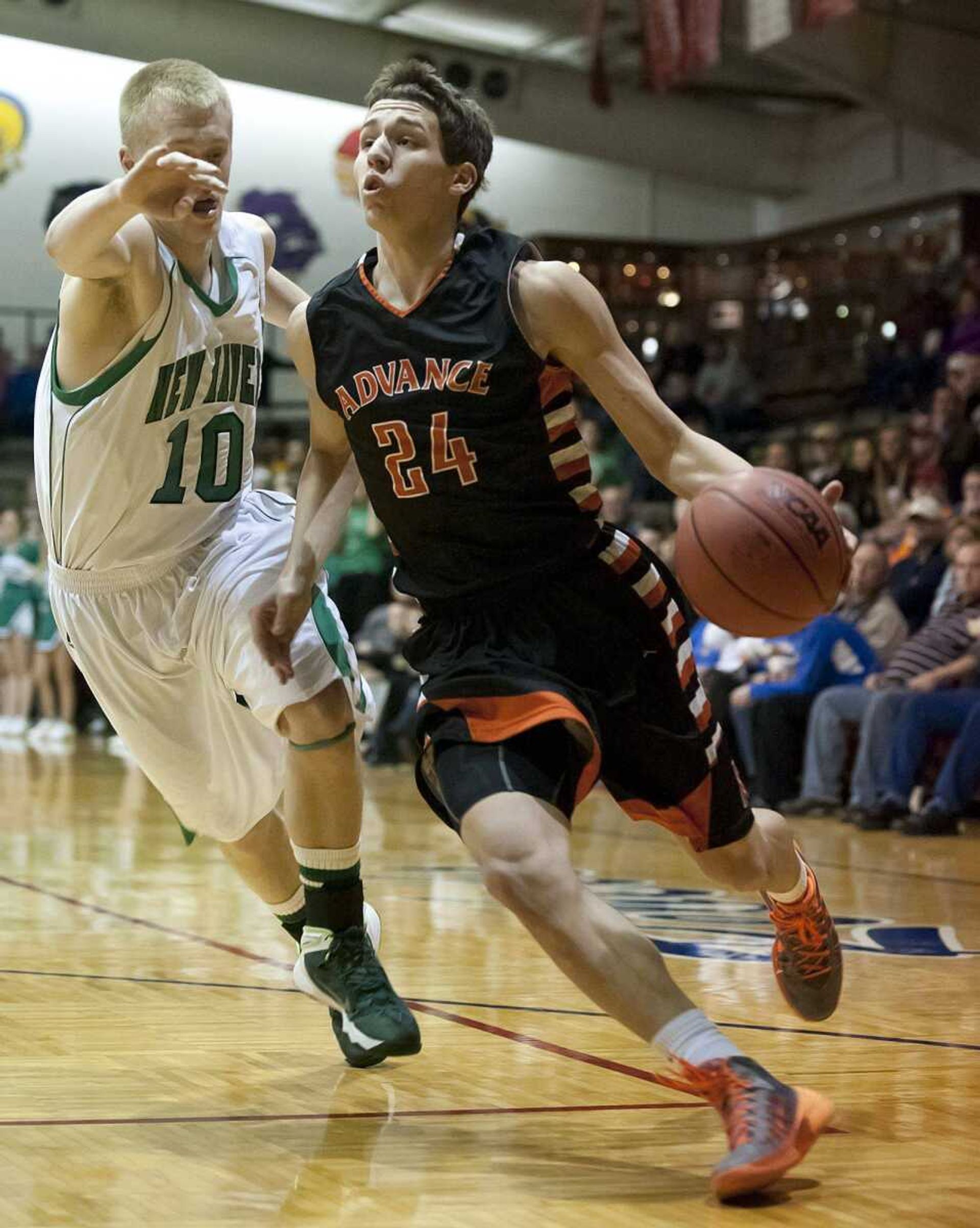 Advance senior Lane Below drives past New Haven forward Kyle Ruediger during the Hornets&#8217; 63-52 win over the Shamrocks on Wednesday in the Class 2 sectional at Central High School in Park Hills, Mo. (Adam Vogler)