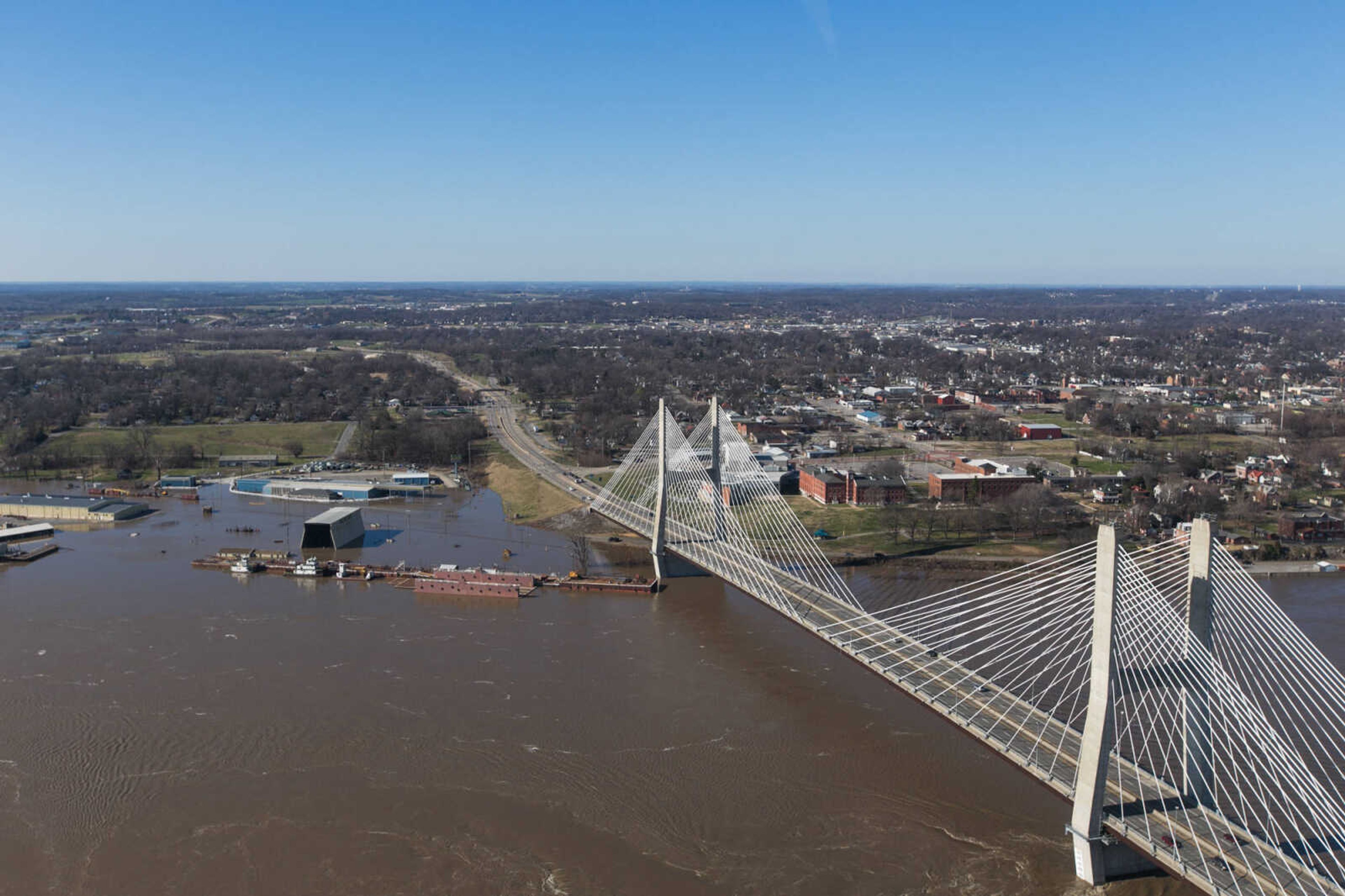 GLENN LANDBERG ~ glandberg@semissourian.com

The swollen Mississippi River is seen flowing under the Bill Emerson Memorial Bridge in Cape Girardeau, Saturday, Jan. 2, 2016.