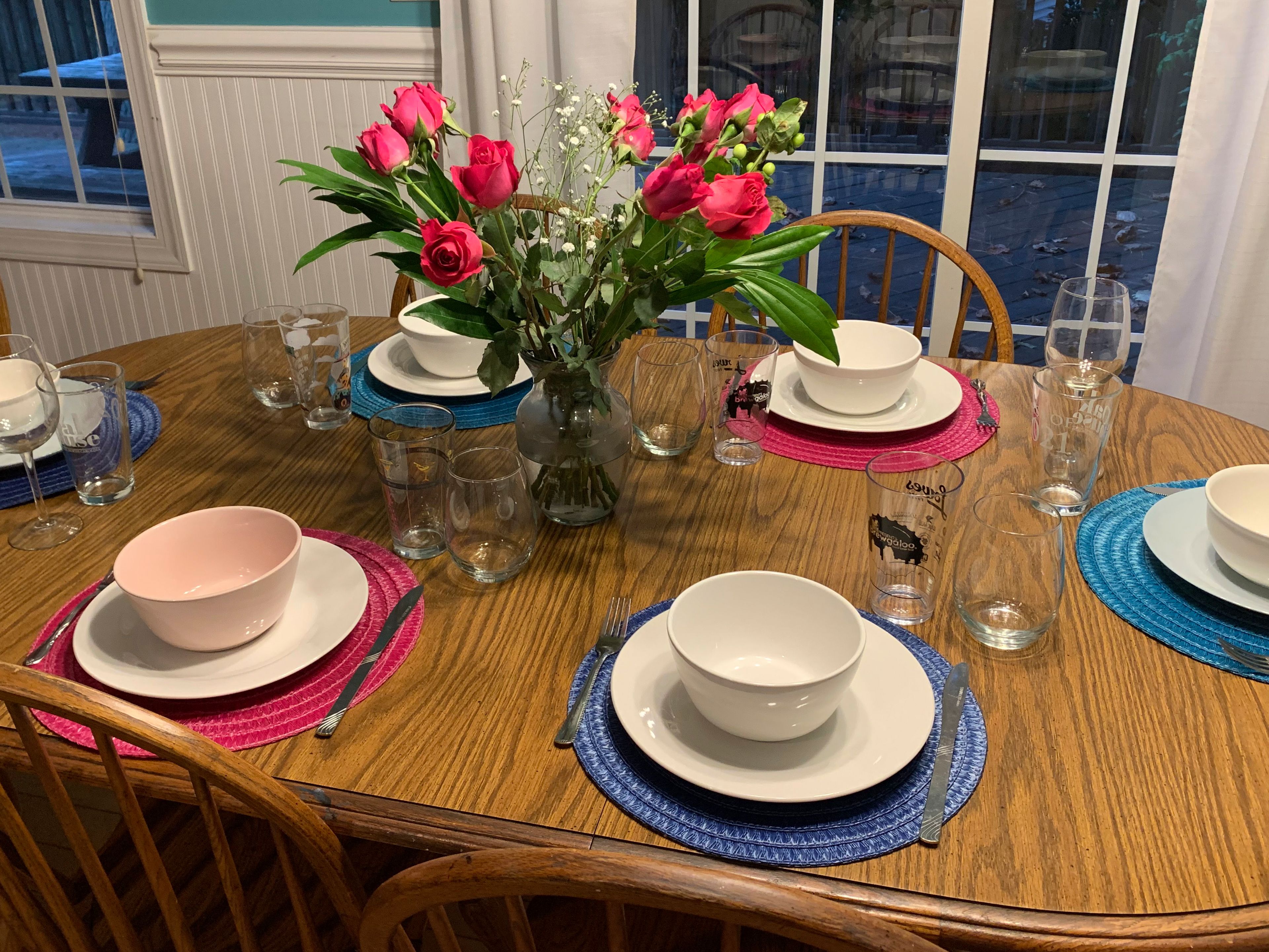 This image provided by Sarah Bellinger shows a table set for a small dinner party with friends on Aug. 25, 2022, in East Hartford, Conn. Bellinger says that throwing her first dinner party was "the most adult thing I did all month." (Sarah Bellinger via AP)wld