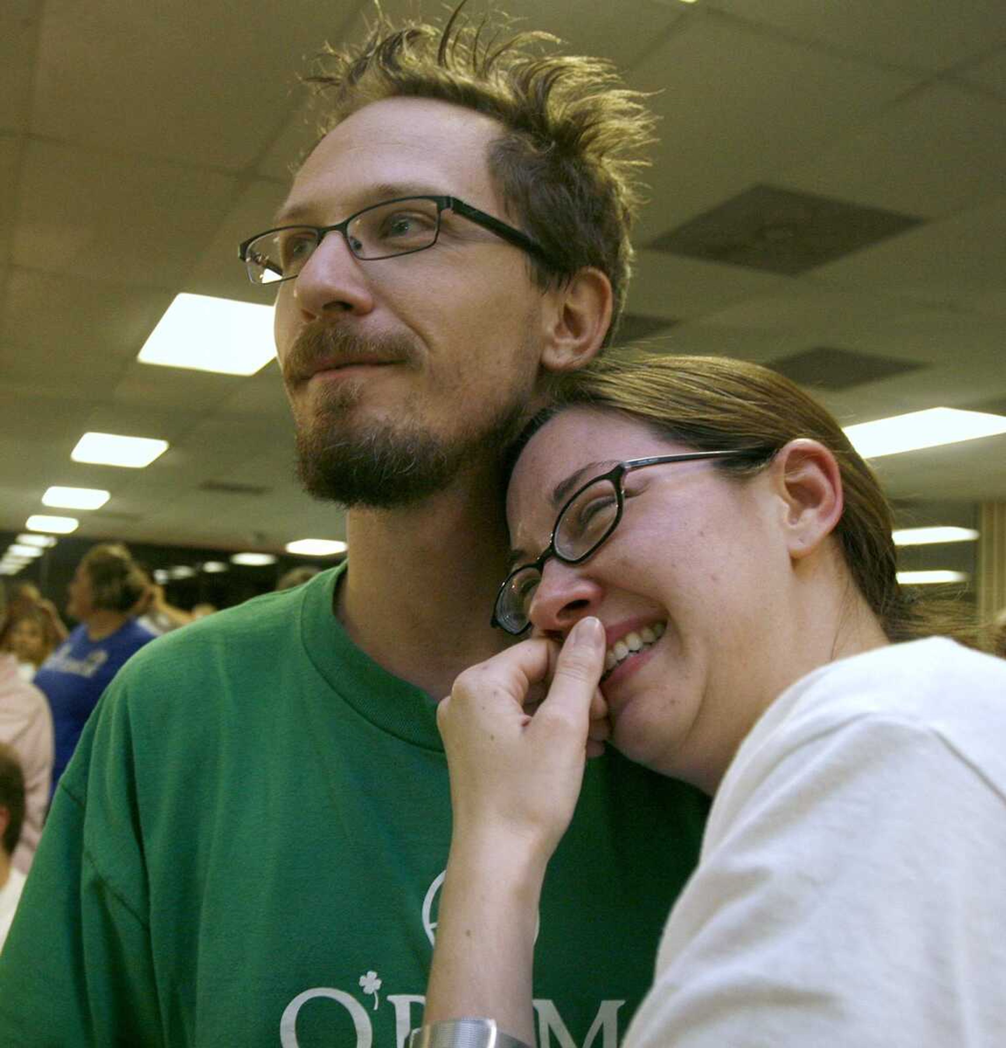 ELIZABETH DODD ~ edodd@semissourian.com
Chris Wubbena, of Cape Girardeau, celebrates with his wife, Jaime Mayfield, crying of happiness, as Barack Obama wins the presidency Tuesday night.