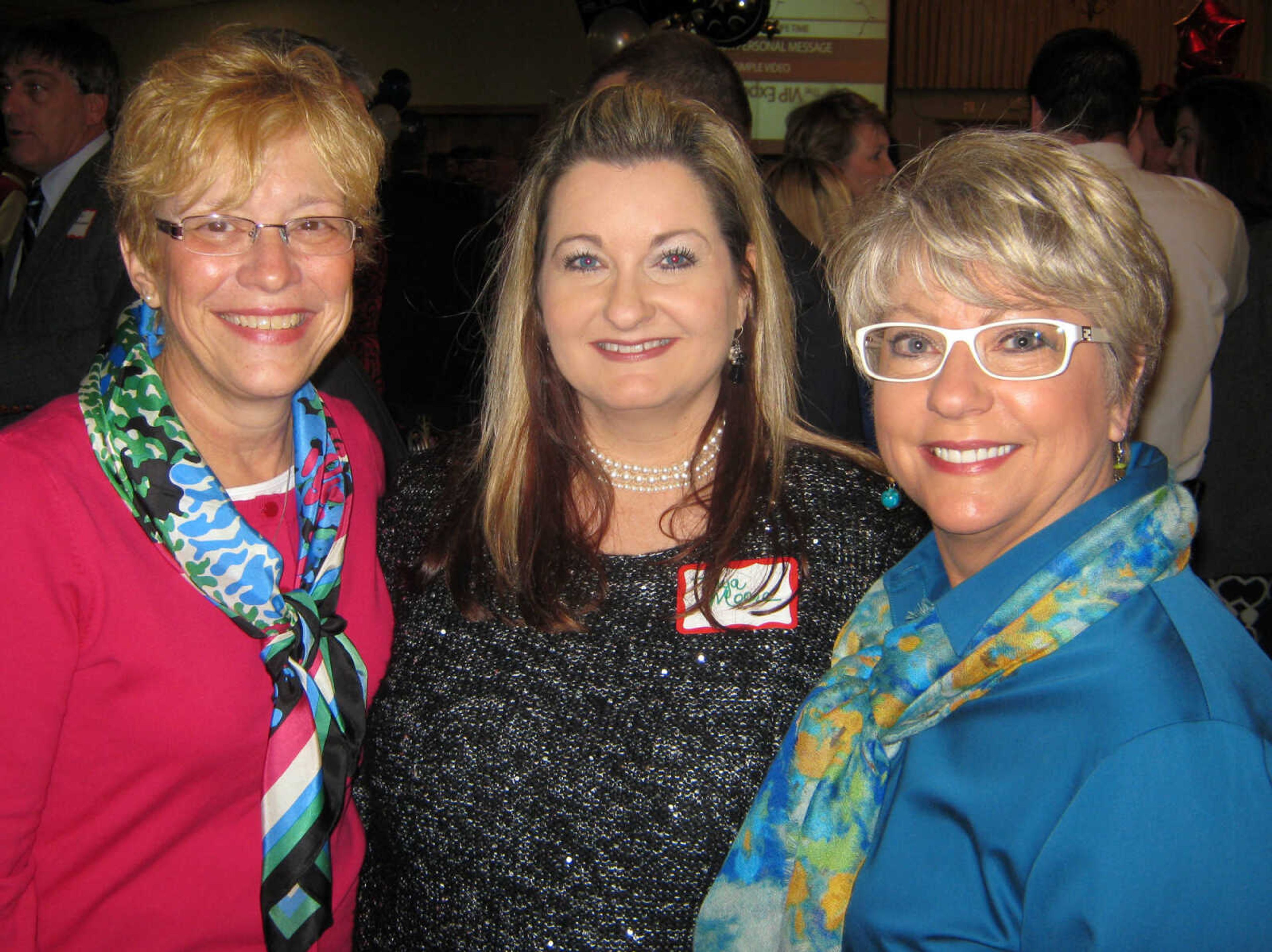 Debbie Devers, Capaha Bank, left; Tonya Moore, Capaha Bank; and Debbie Essner, Capaha Bank, pose at the Jackson Area Chamber of Commerce annual awards banquet, Jan. 11, at the the Knights of Columbus Hall in Jackson, Mo.